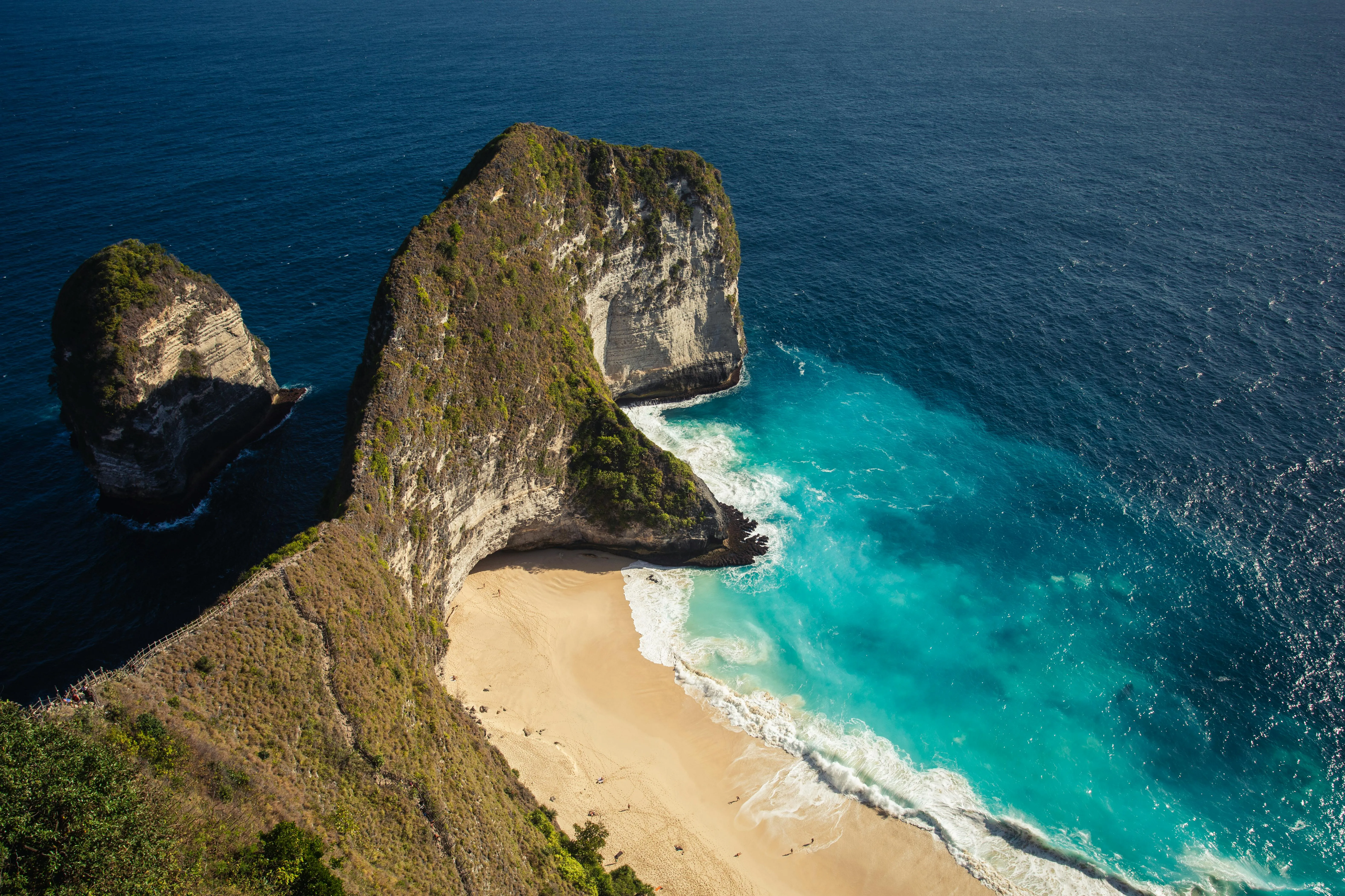 Top View of Rugged Coastline with Turquoise Blue Water