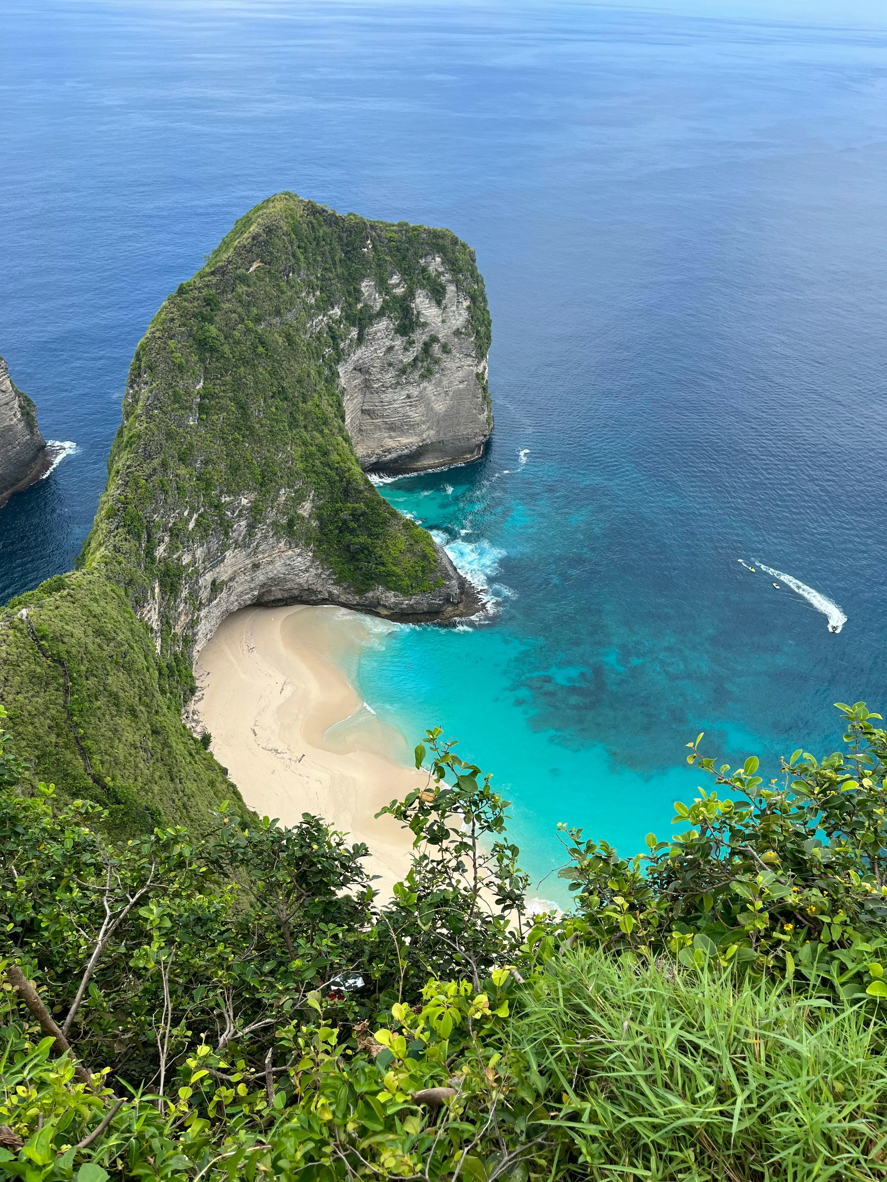 Tropical Beach with Rocky Cliffs and Clear Water Scene