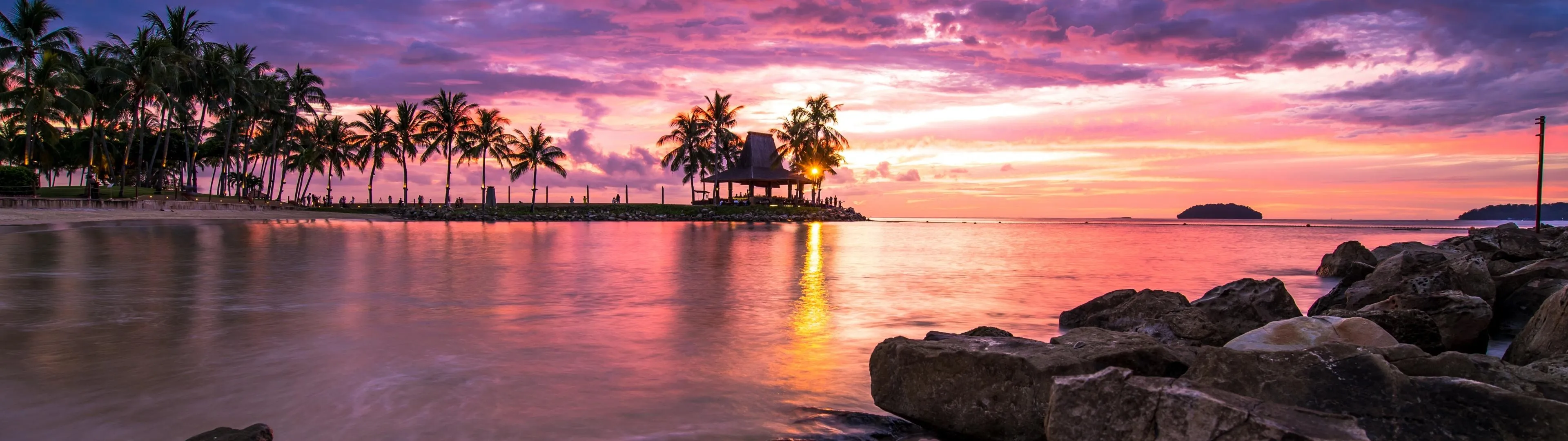 Vibrant Sunset Paints the Sky over a Calm Tropical Beach