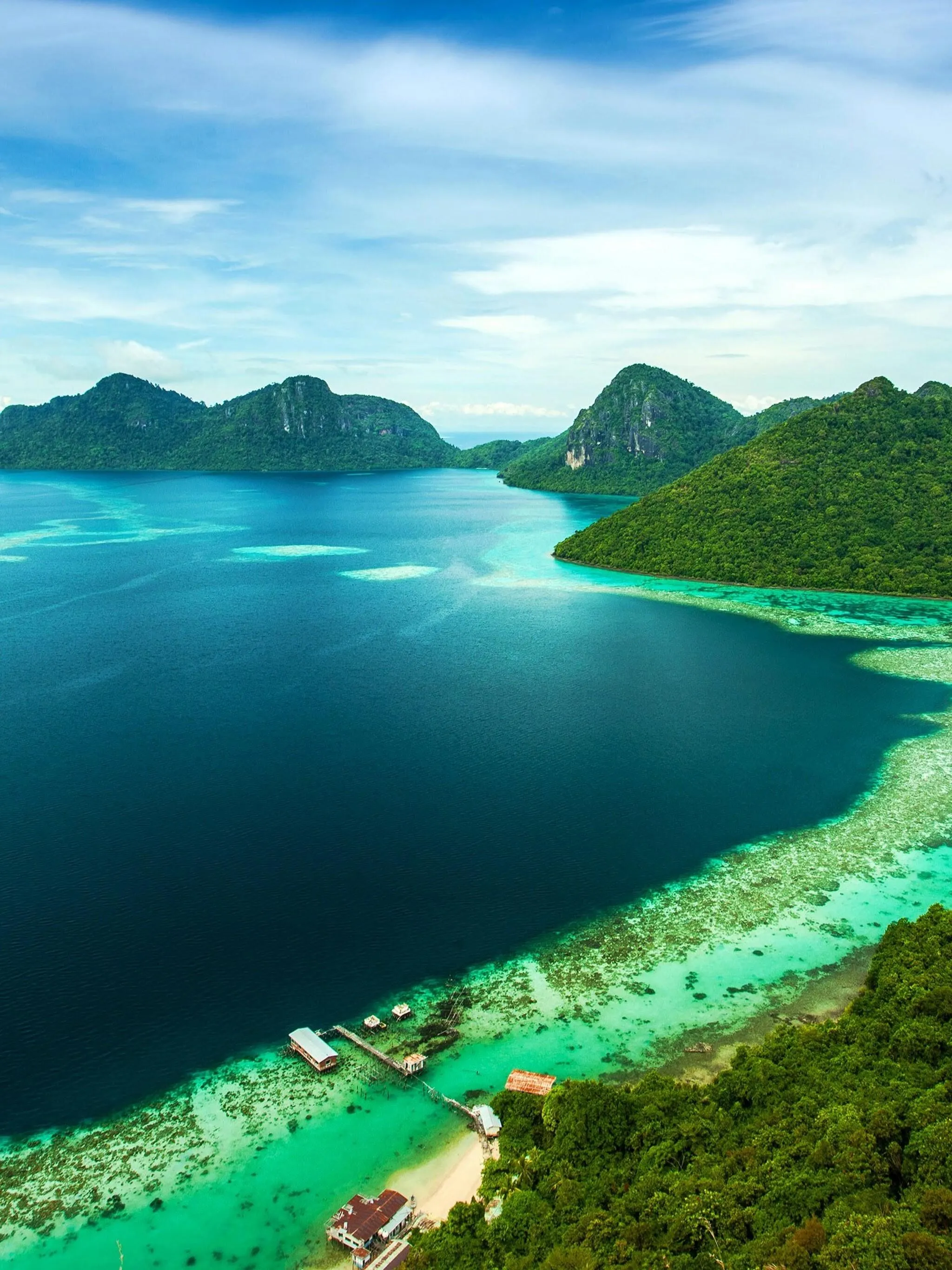 Vibrant Tropical Island with Green Hills and Blue Ocean