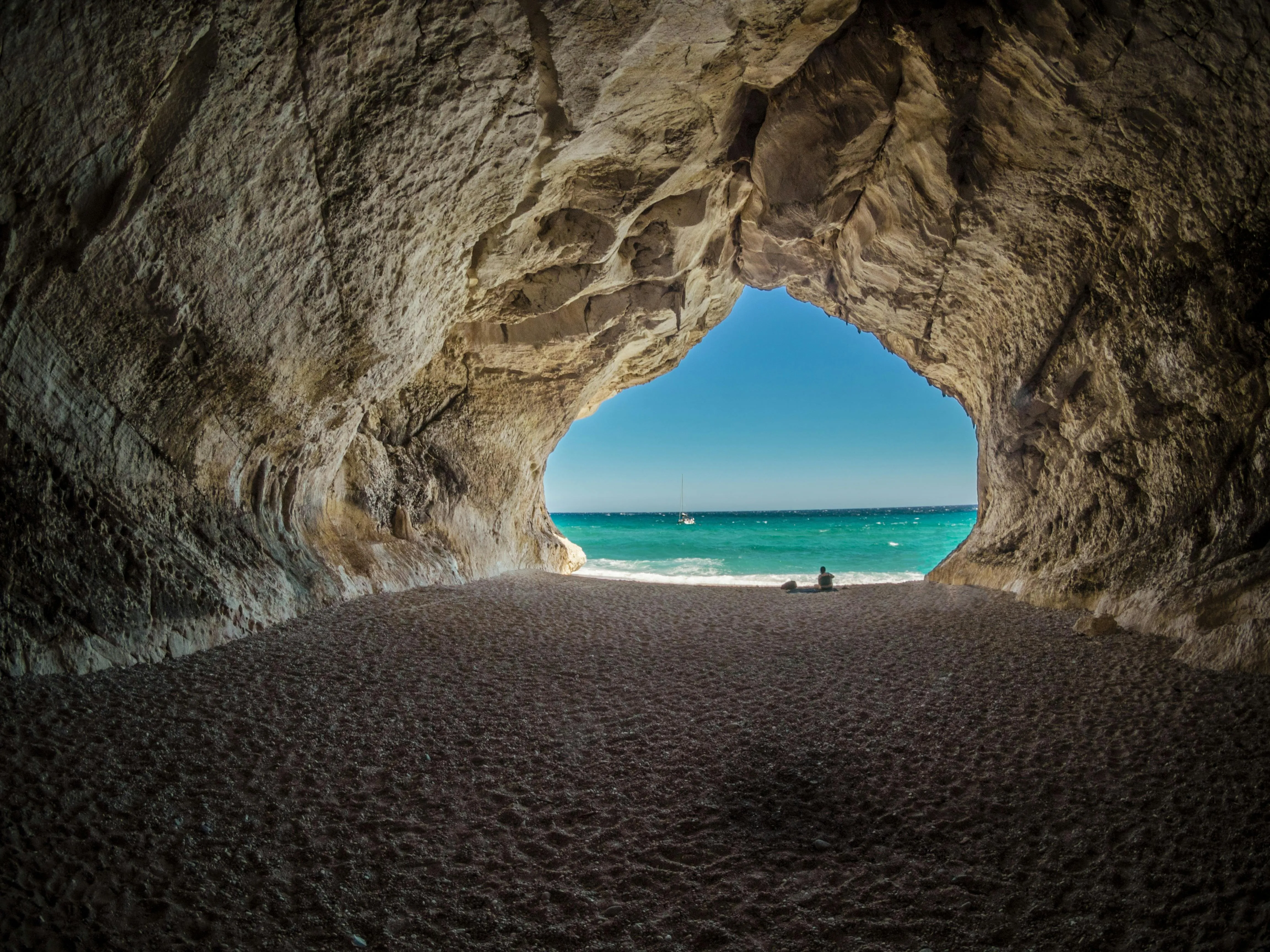 View from Inside Cave Near the Bright Blue Ocean Wallpaper