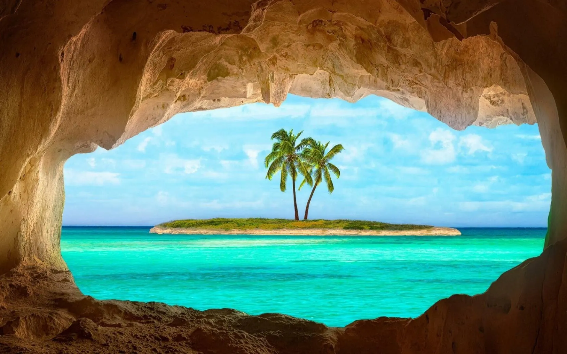 View of a Tropical Island Through a Rocky Seaside Cave