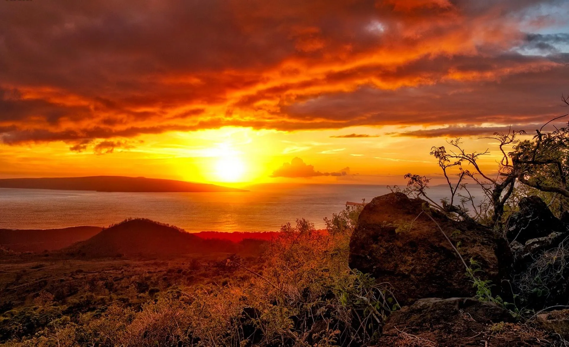 Warm Evening Sun Setting Behind Cliffs and Peaceful Sea