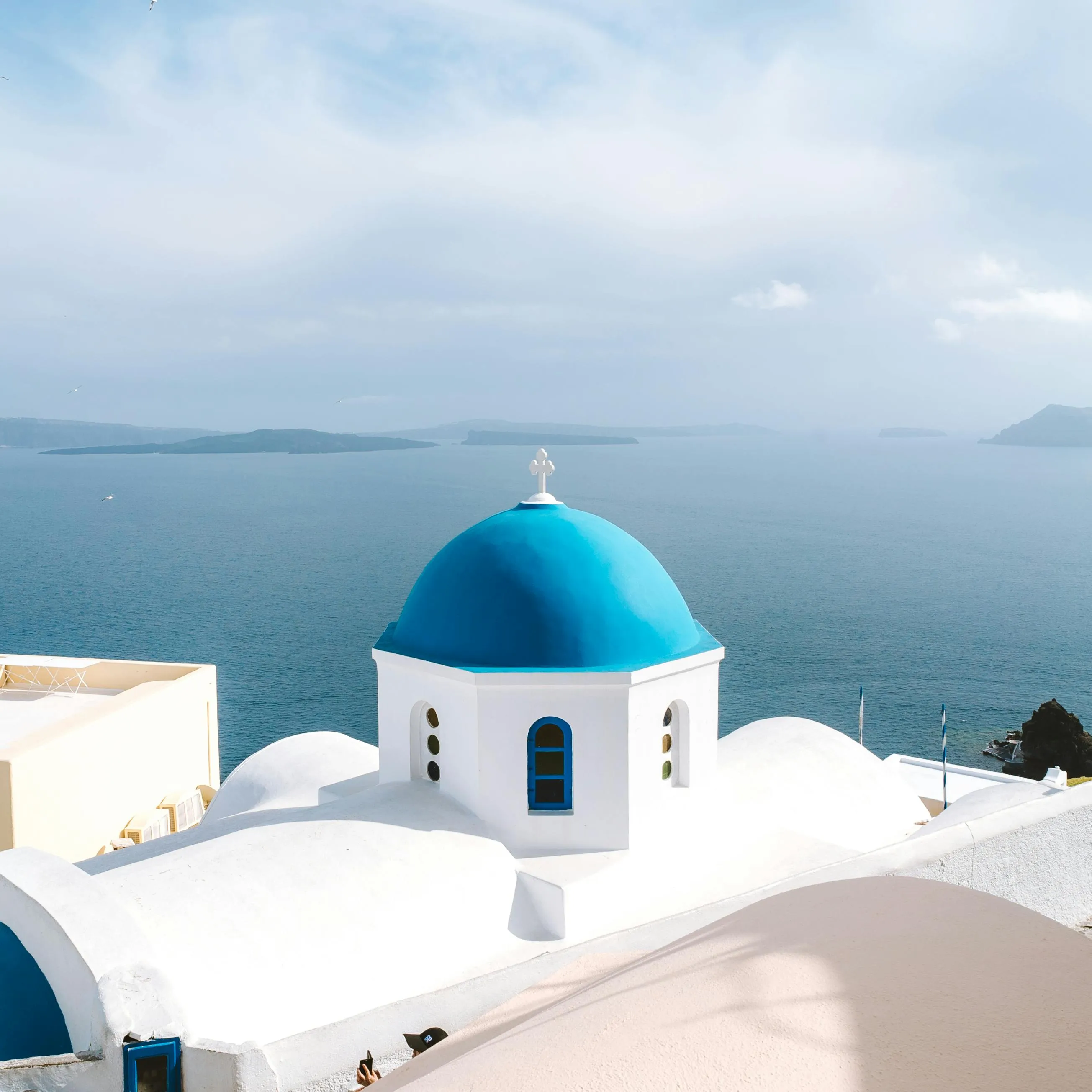 White Church with Blue Dome Overlooking the Ocean View