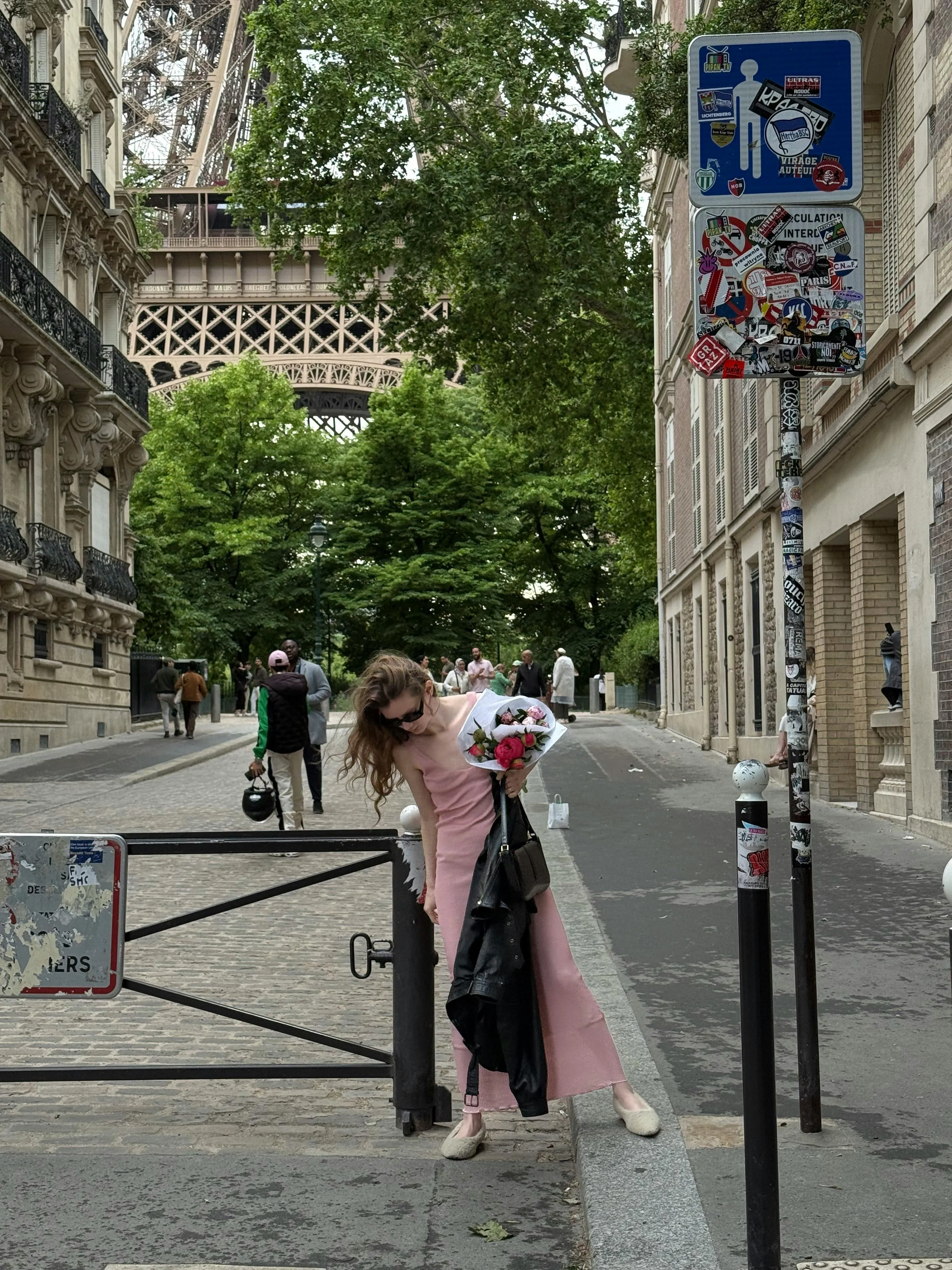 Woman Walking in a Paris Street with the Eiffel Tower View