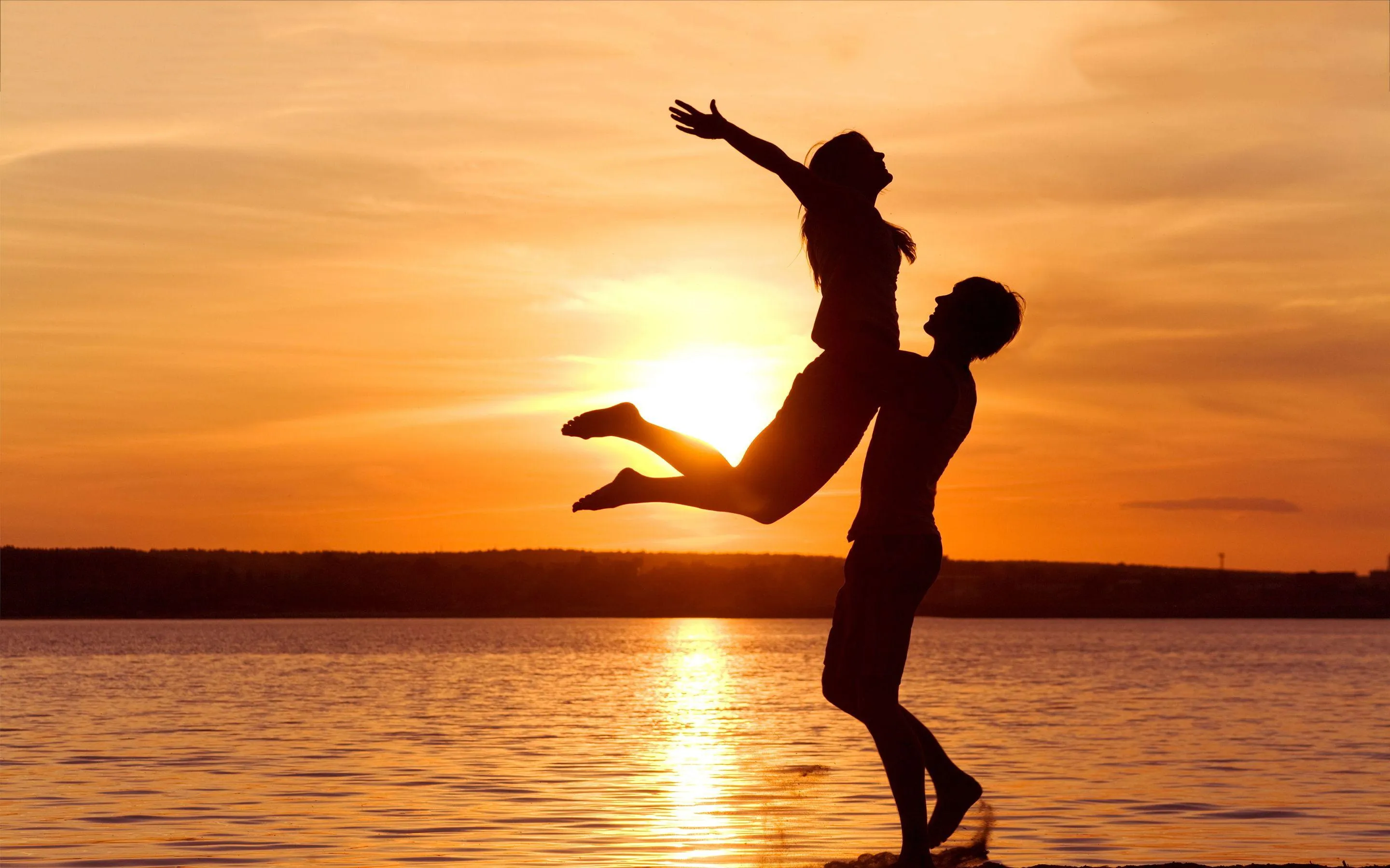 Beach Sunset Dance Capturing Joyful Romantic Love Wallpaper