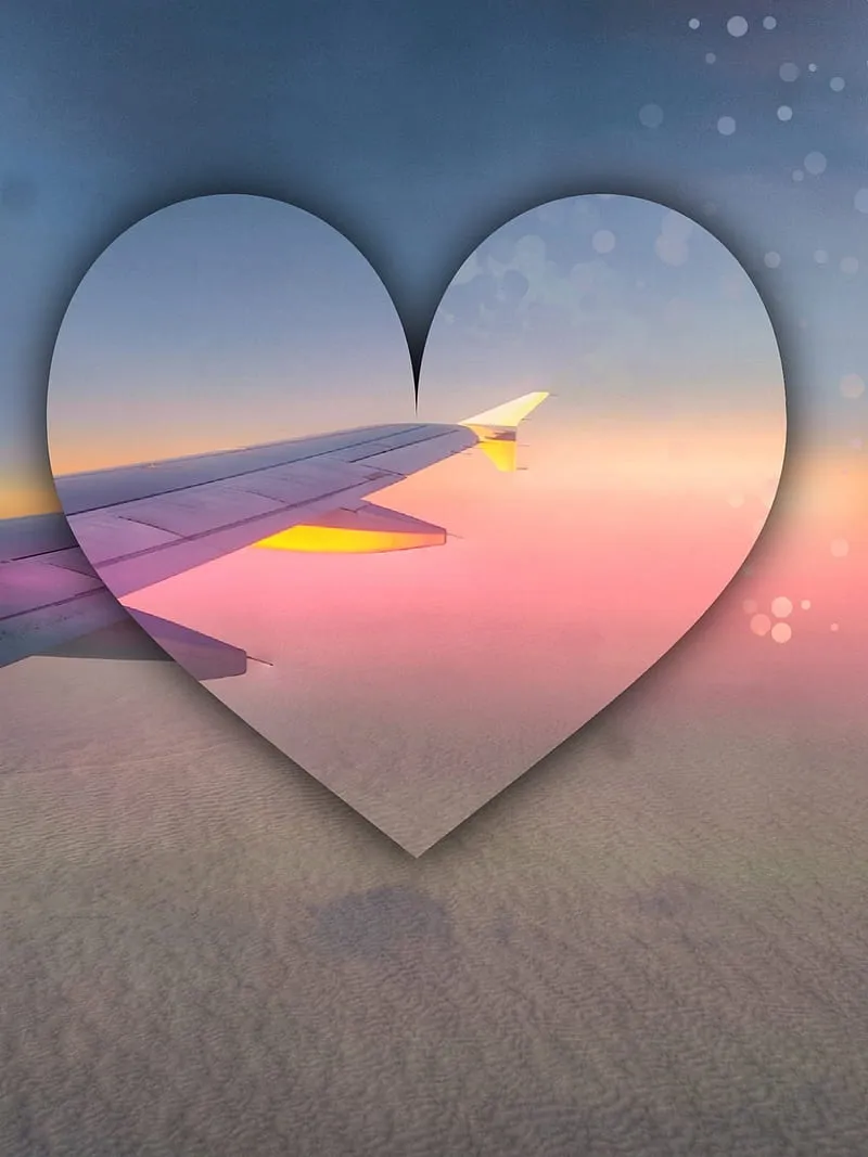 Beautiful Sunset View Through Airplane Window Heart