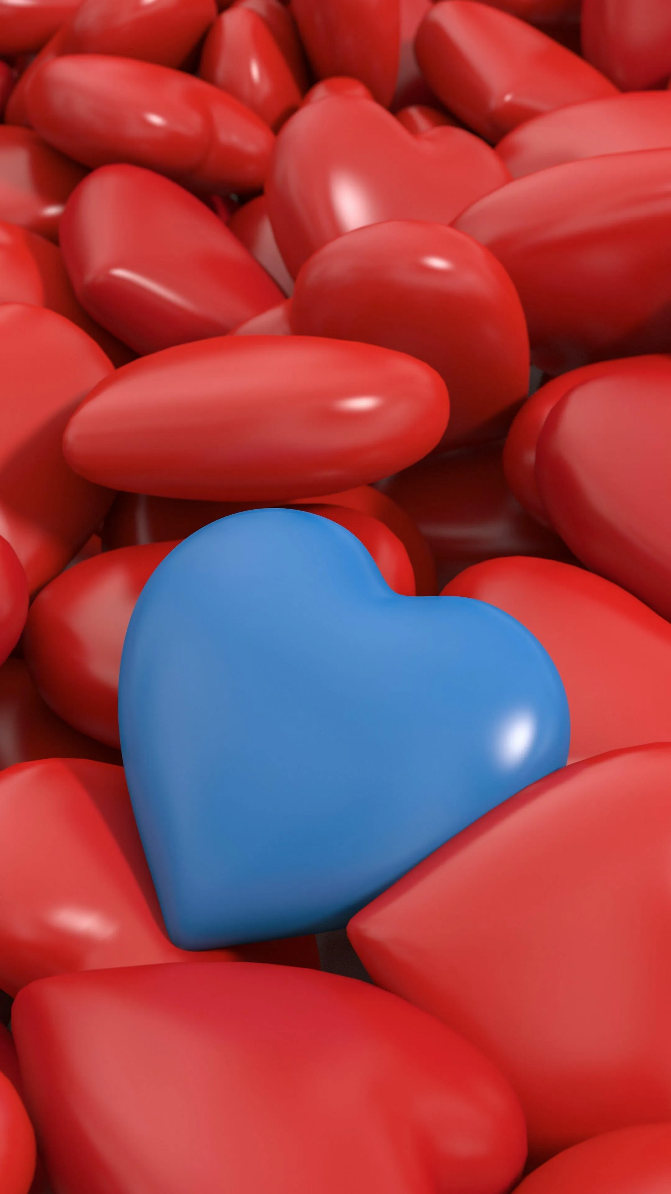 Blue Heart Among Red Hearts Showing True Devotion Wallpaper