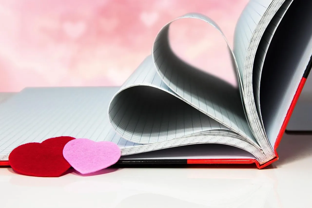 Book Pages Shaped as Heart for Romantic Readers Wallpaper