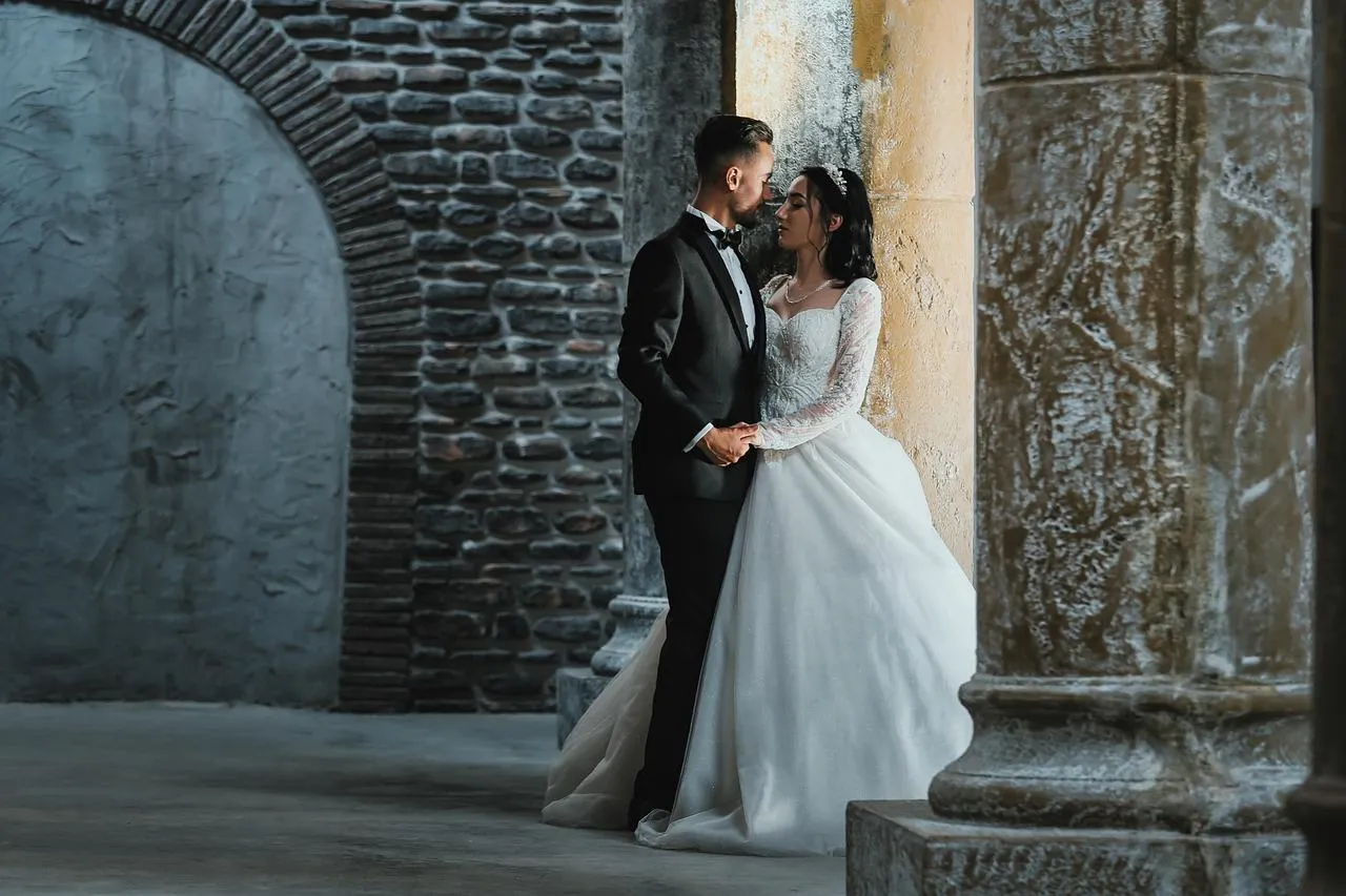 Bride and Groom Sharing a Moment of Pure Love Wallpaper