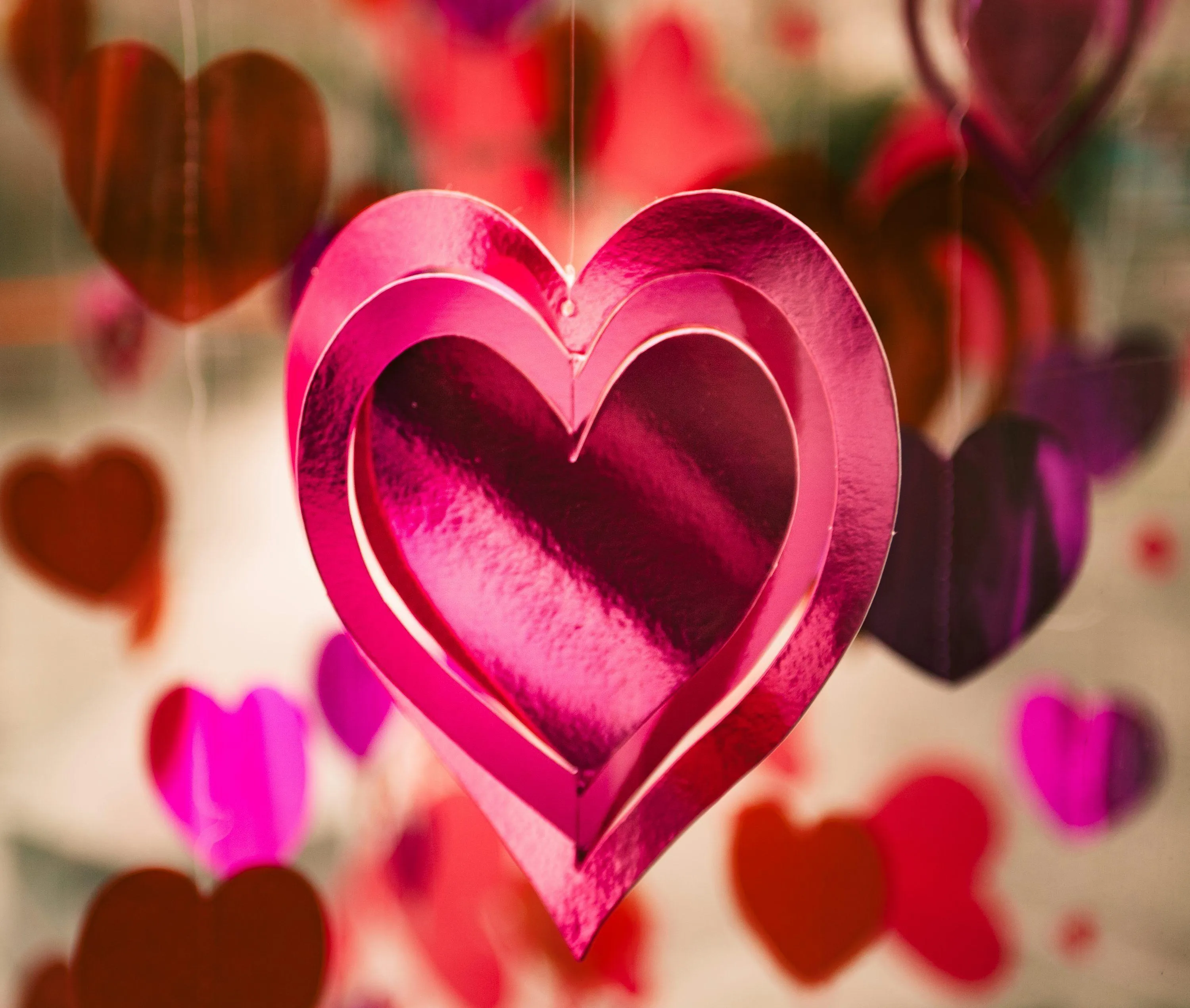 Bright Pink Heart Surrounded by Love Petals Wallpaper