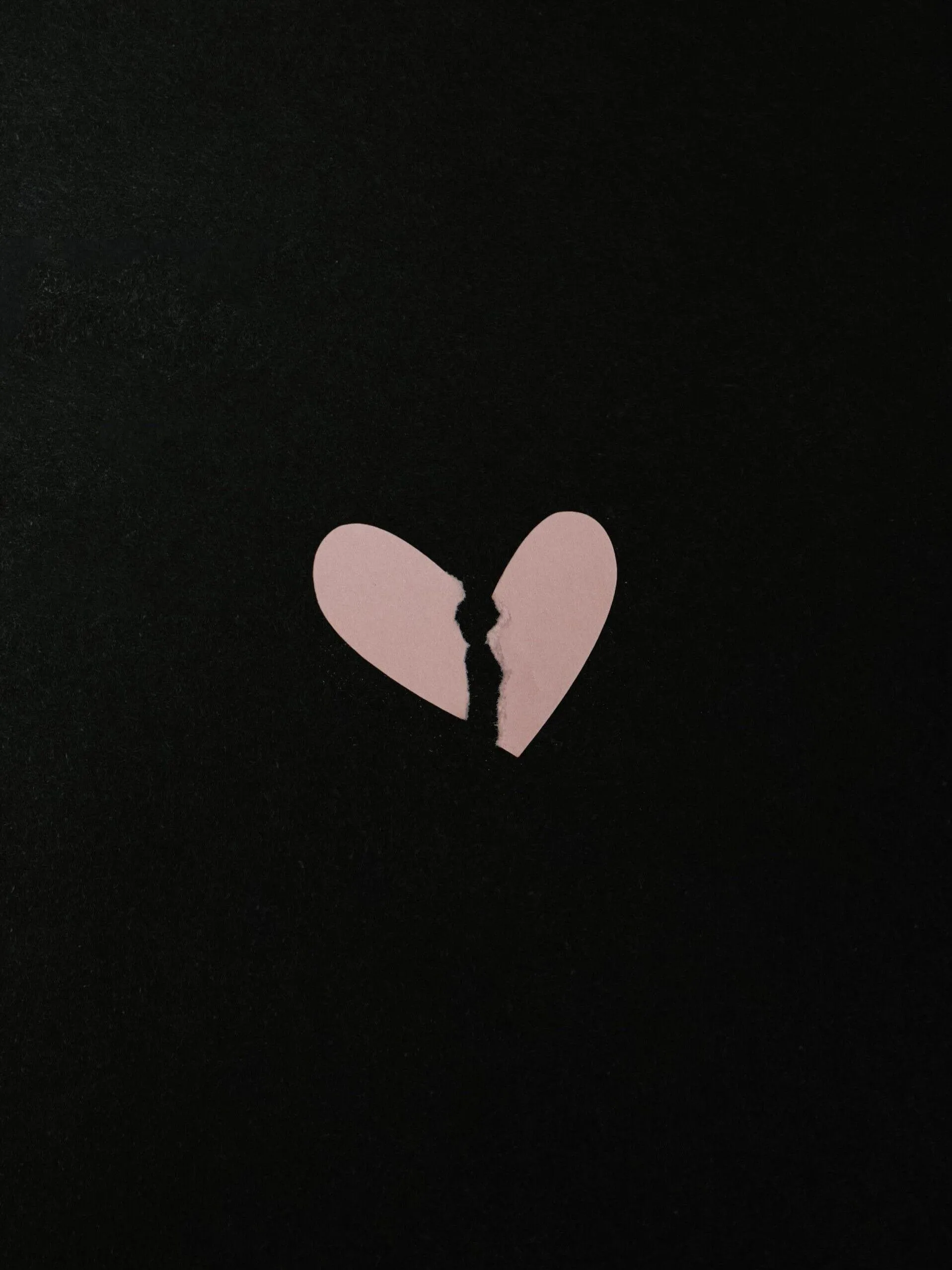 Broken Pink Paper Heart Reflecting Emotional Pain Wallpaper