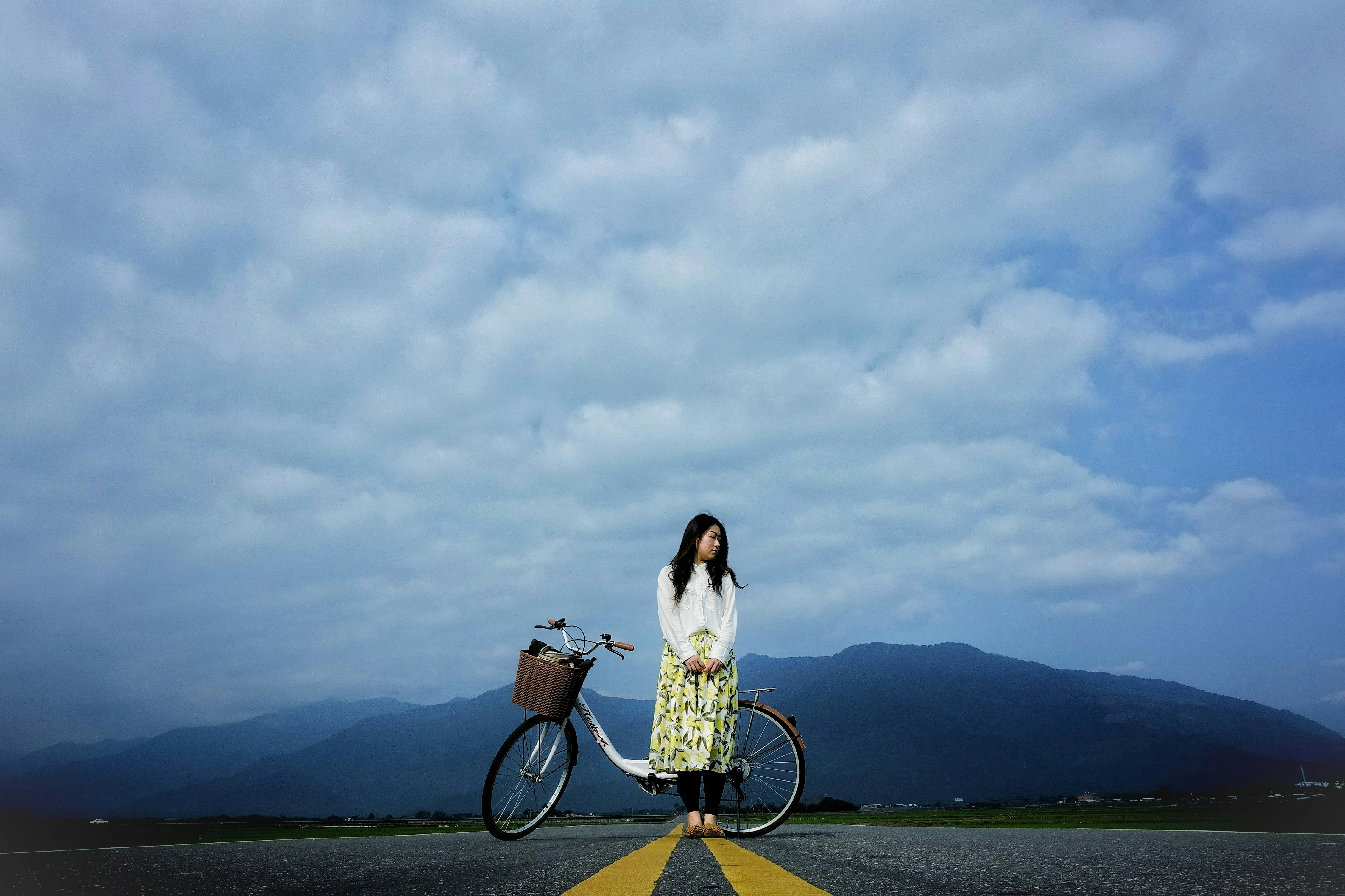 Calm Moment on Open Road with Bicycle and Mountains