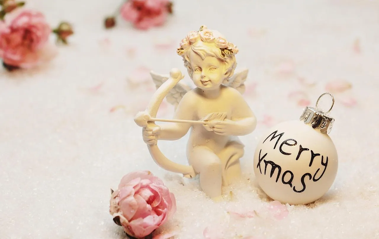 Christmas Angel Figurine with Merry Xmas Ornament Wallpaper