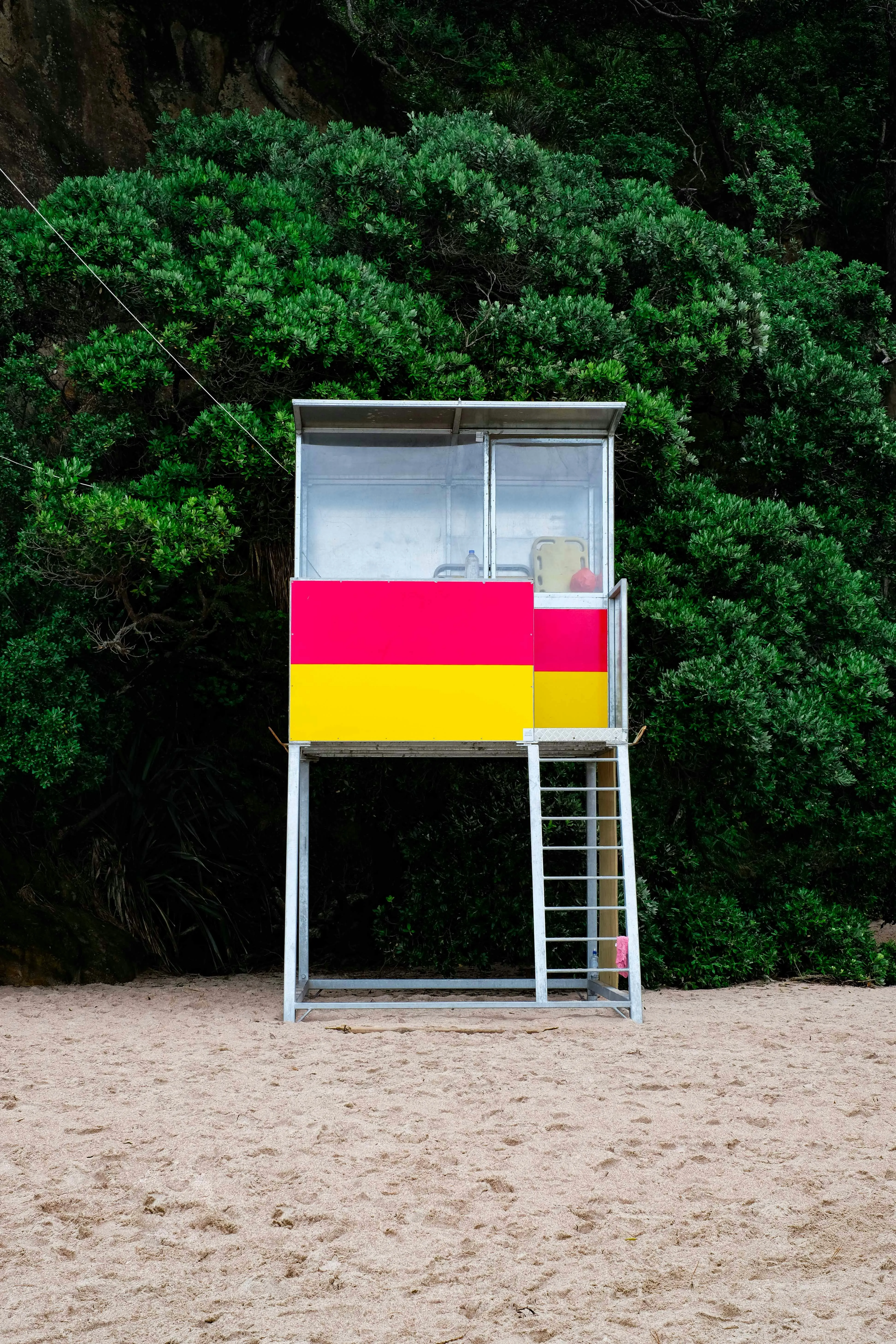 Colorful Flag Board on Beach Showing Unity and Peace