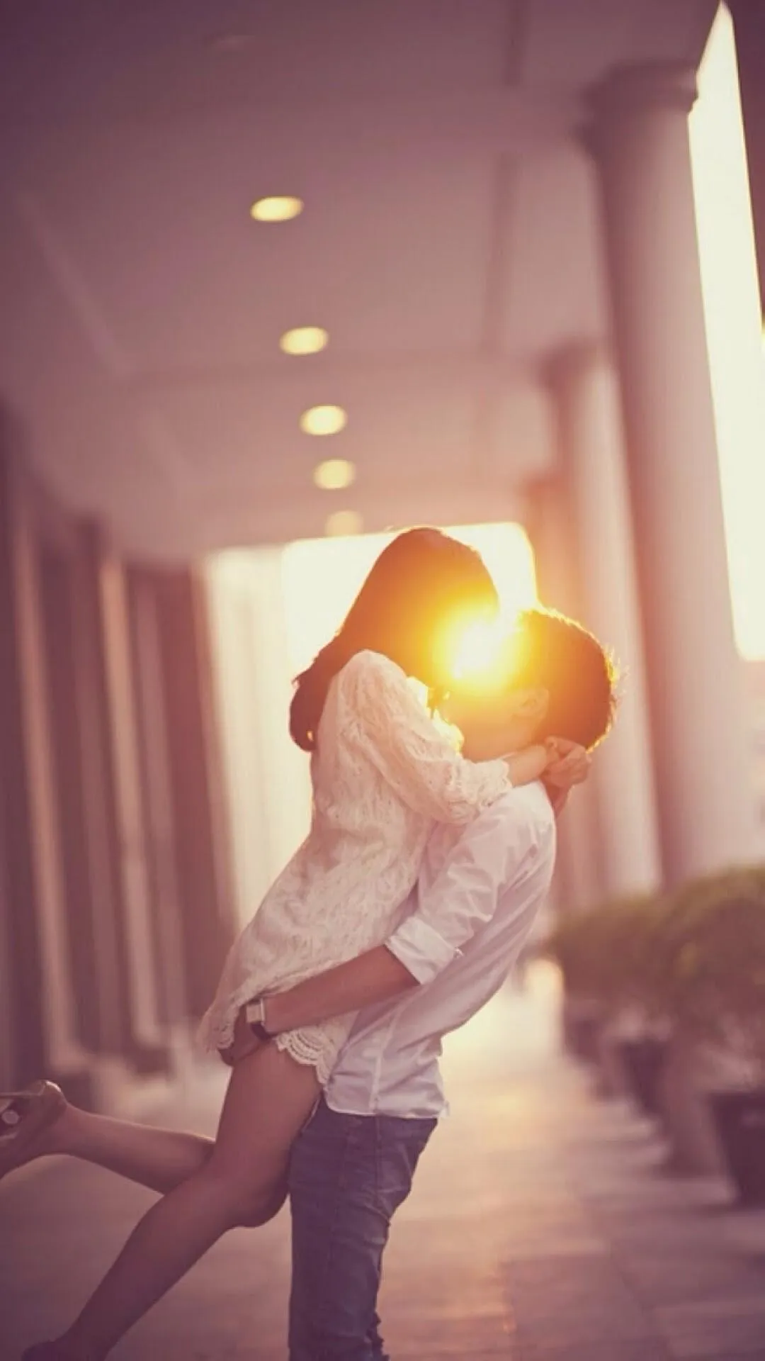 Couple Embracing Showing Warmth and Passion Wallpaper