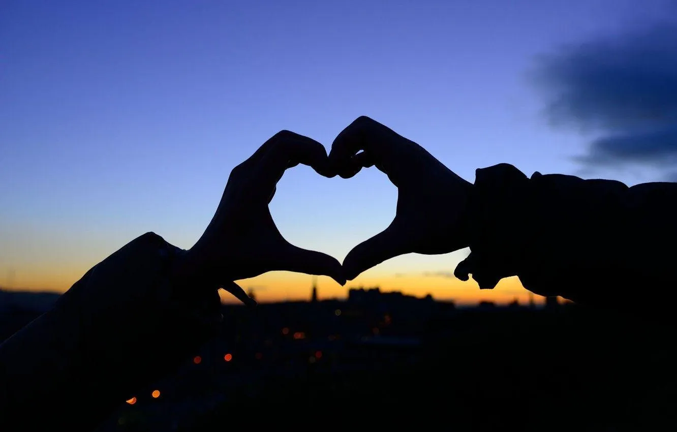 Couple Framing Heart Silhouette at Golden Sunset HD Image