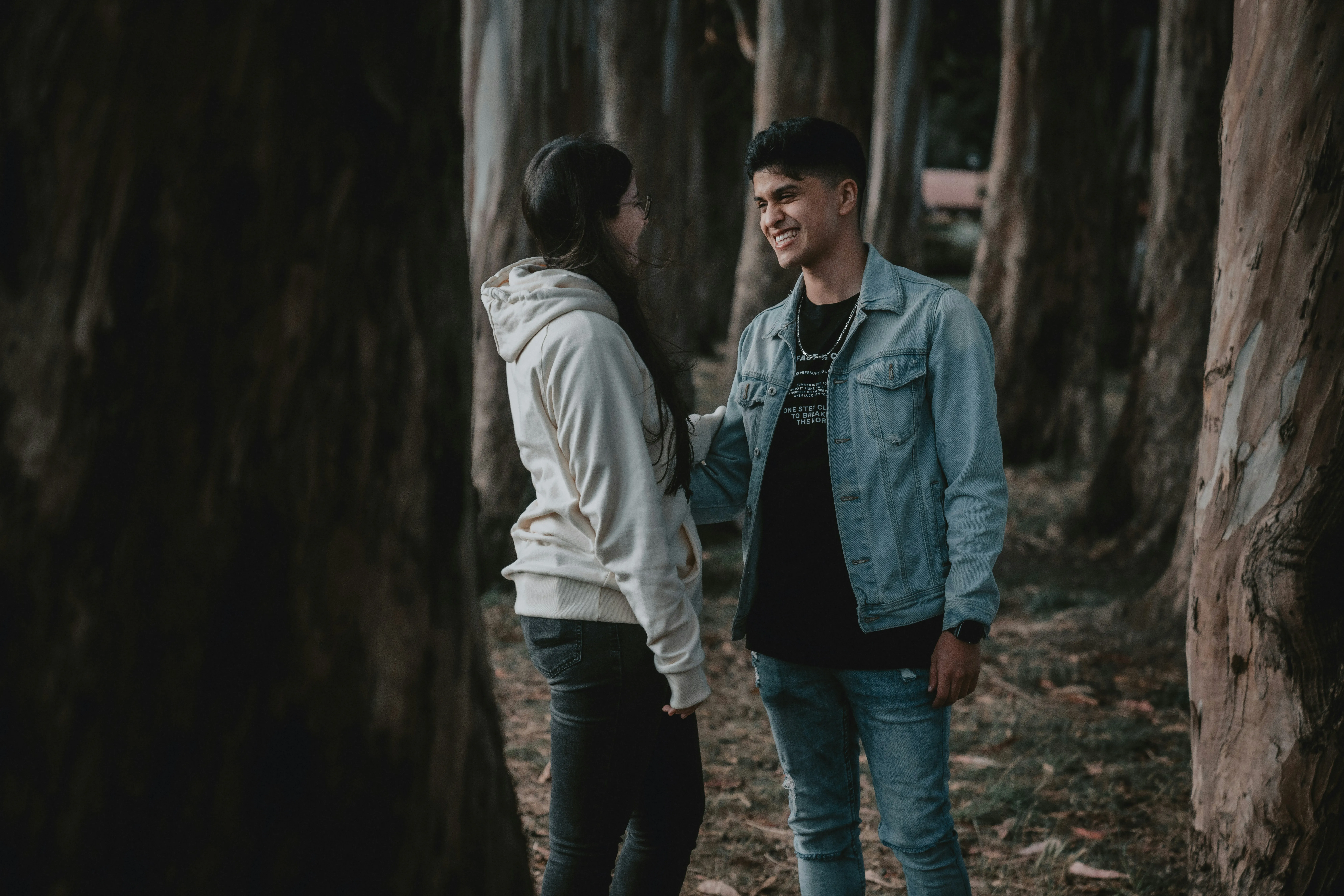 Couple Having Sweet Conversation in Quiet Park Wallpaper