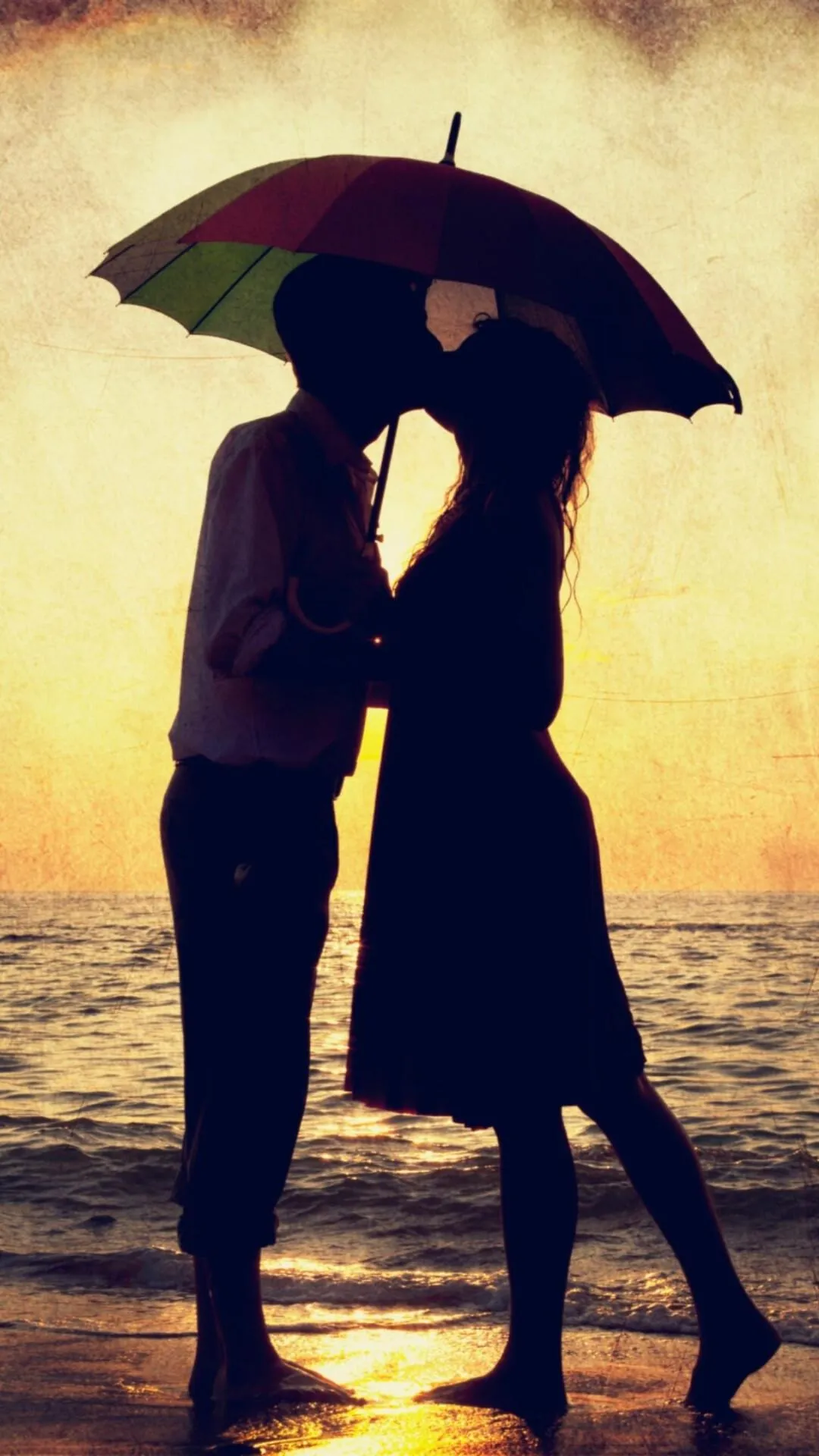 Couple Sharing Umbrella During Rainy Romantic Walk