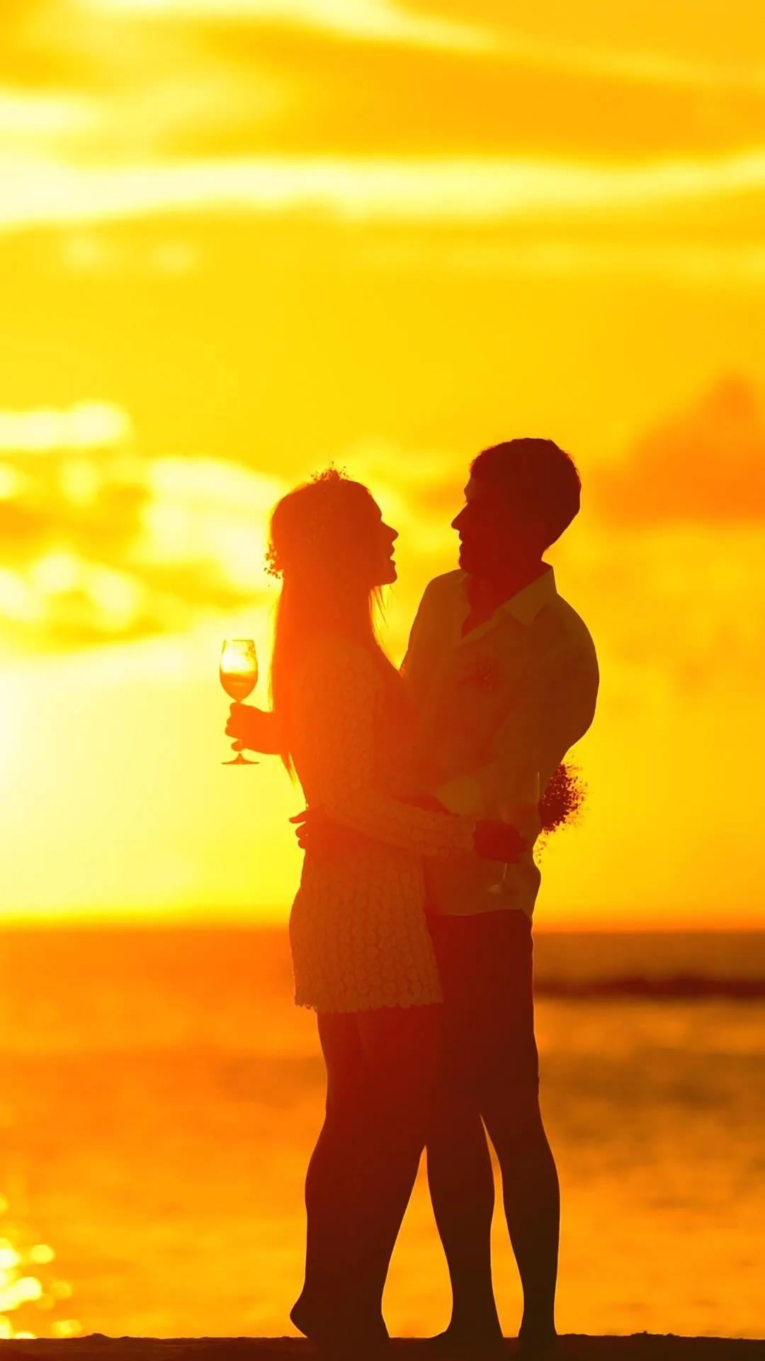 Couple Silhouette at Sunset Sharing Tender Moment Image
