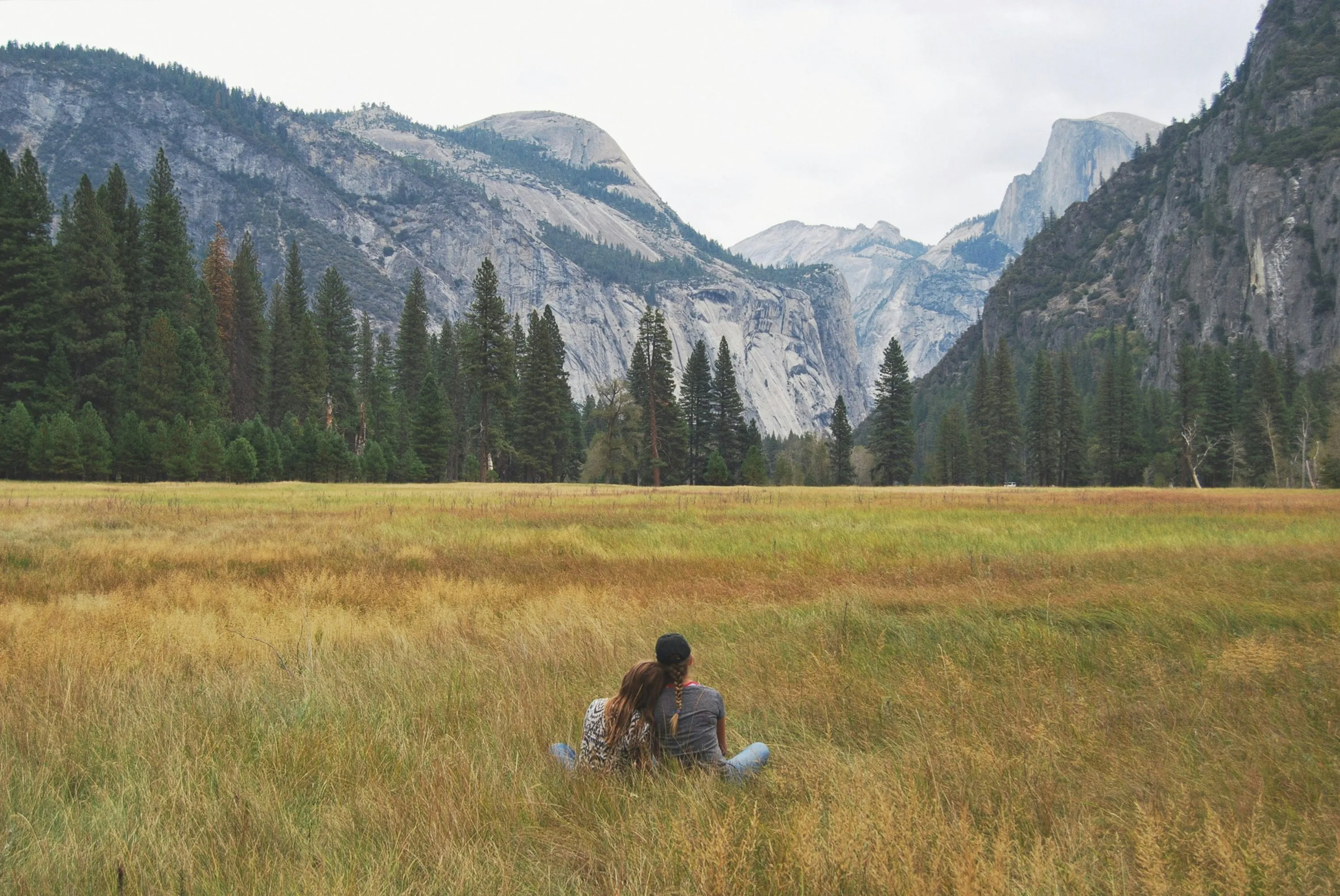 Couple Sitting in Nature Enjoying Peaceful Love Wallpaper