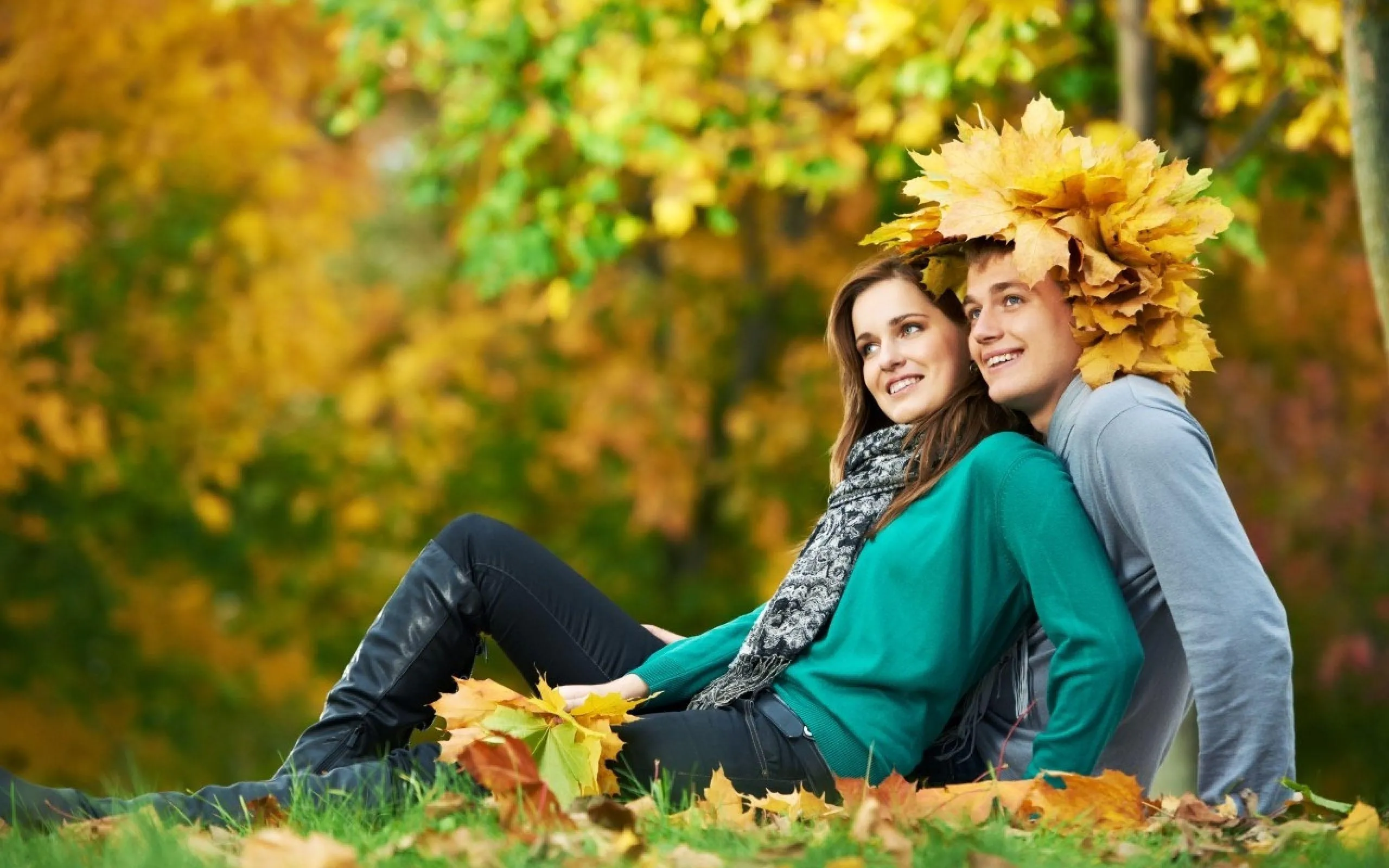 Couple Sitting on Grass Expressing Young True Love