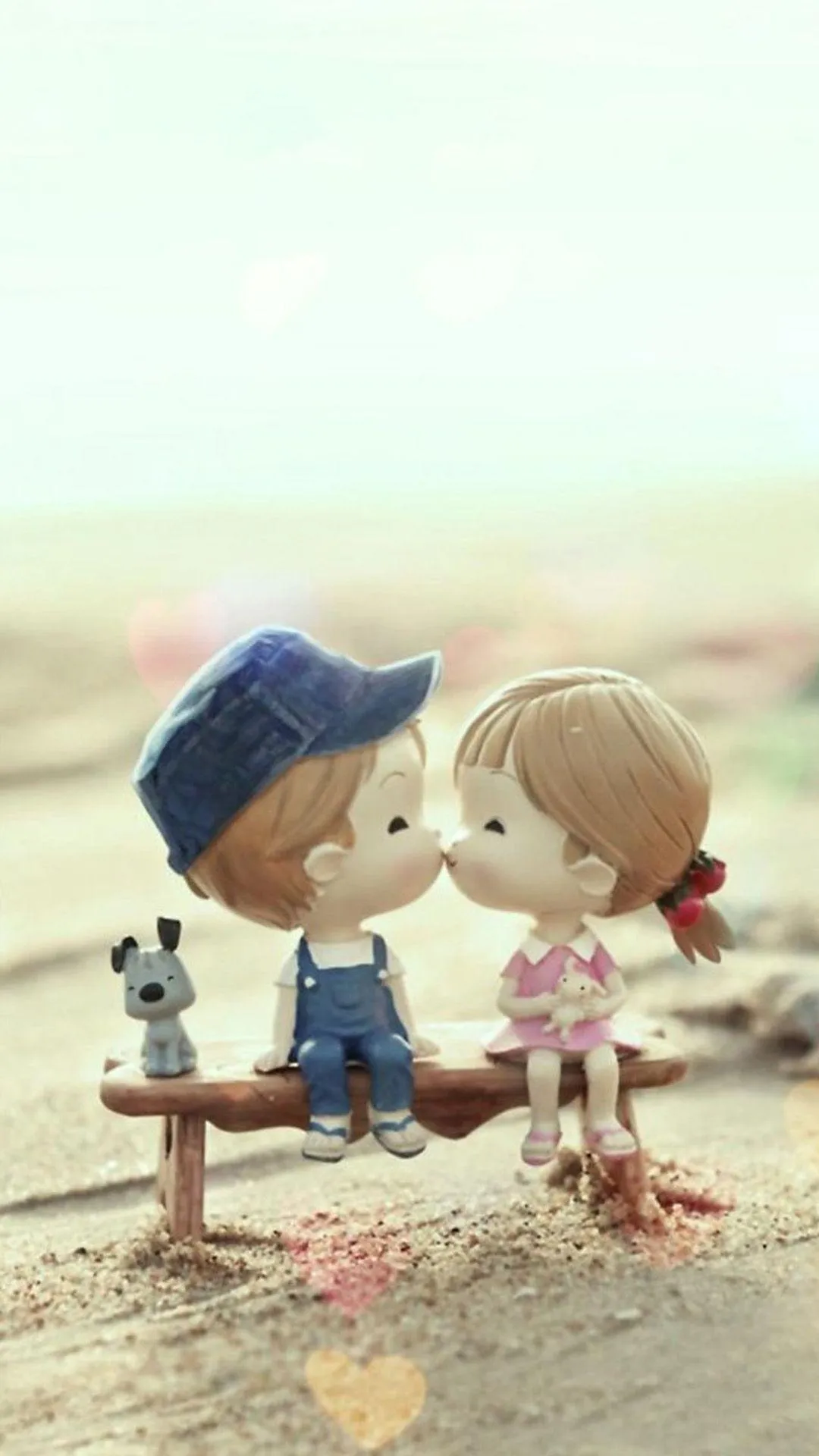 Cute Couple Figurines Sharing Innocent True Love Wallpaper