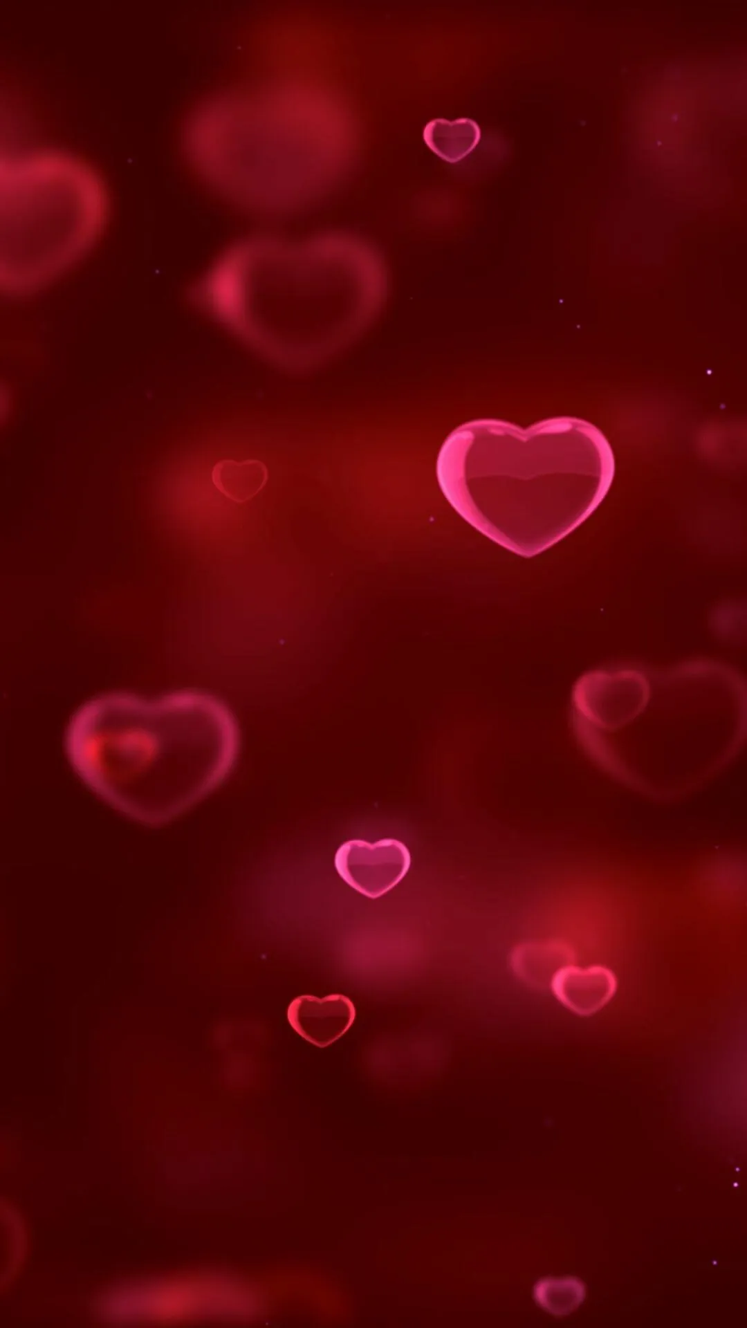 Floating Red Hearts in Soft Romantic Lighting Wallpaper