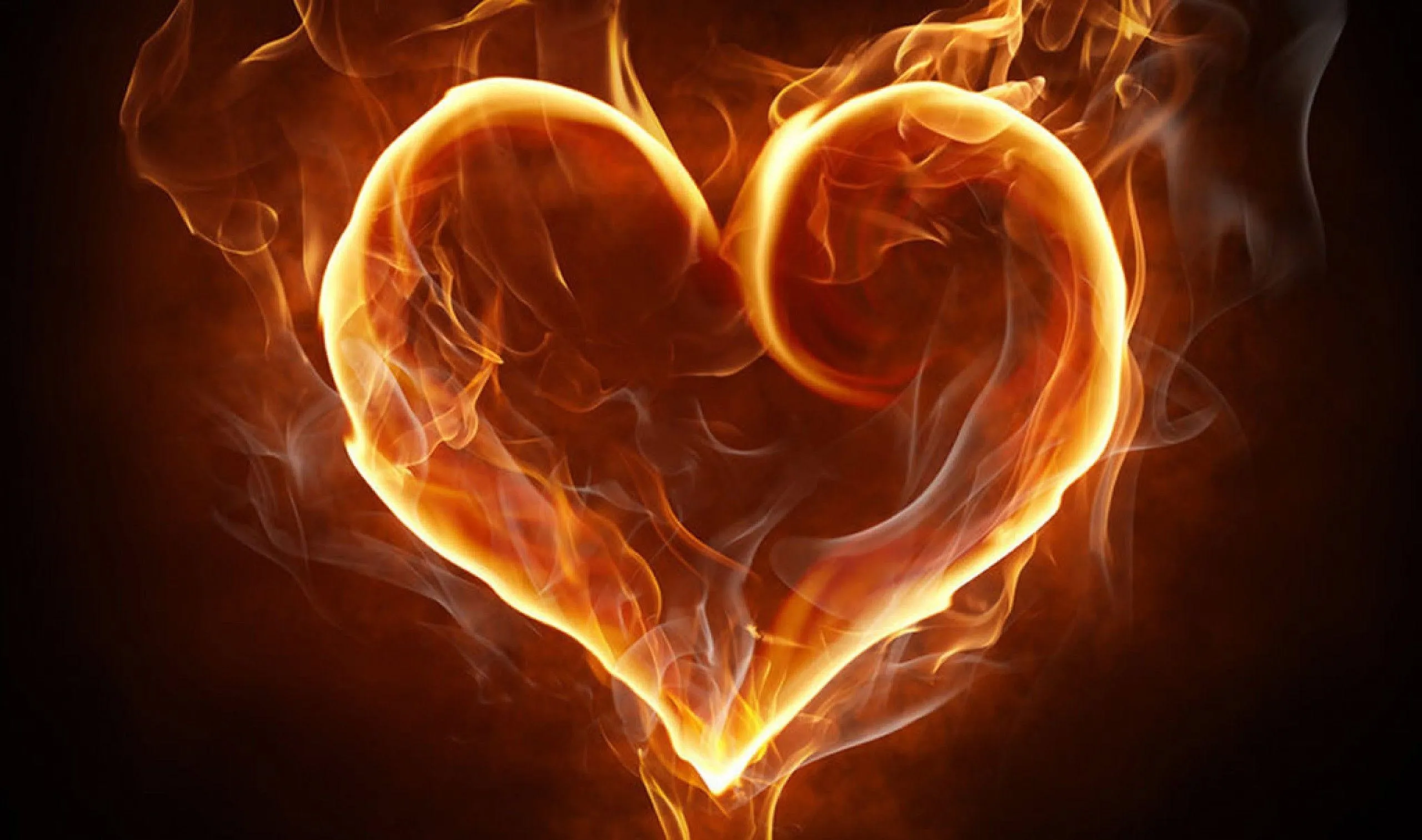 Glowing Fire Heart in Darkness Expressing Desire Wallpaper