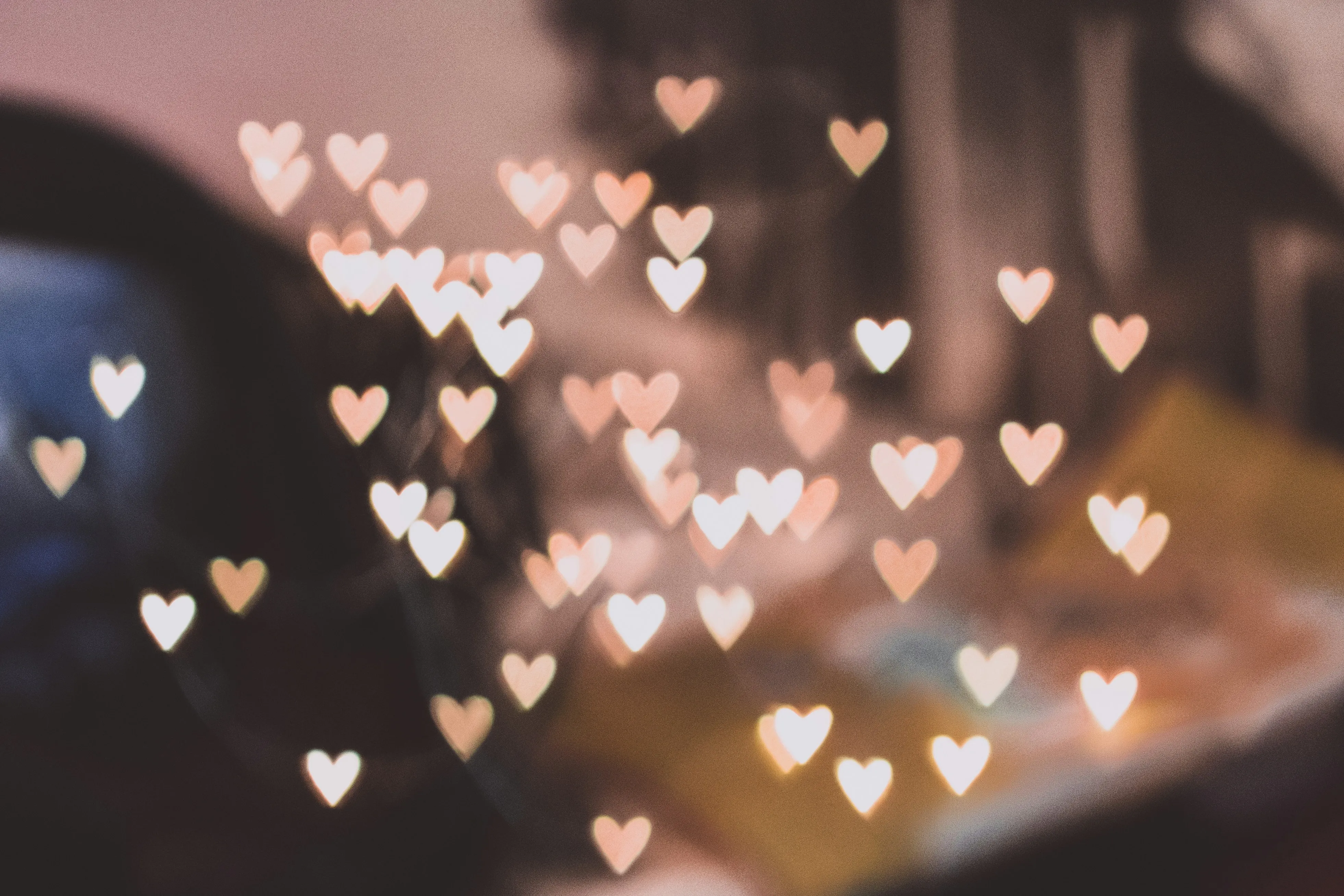 Glowing Heart Bokeh Lights Creating Warm Ambience Wallpaper