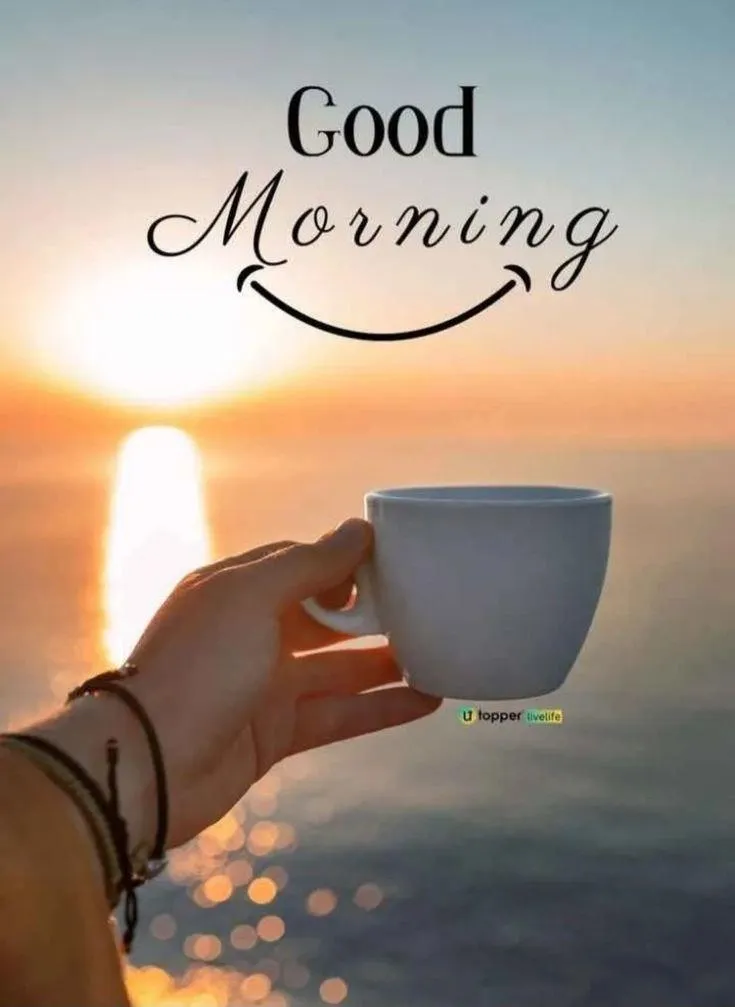 Hand Holding Cup with Good Morning Text Wallpaper