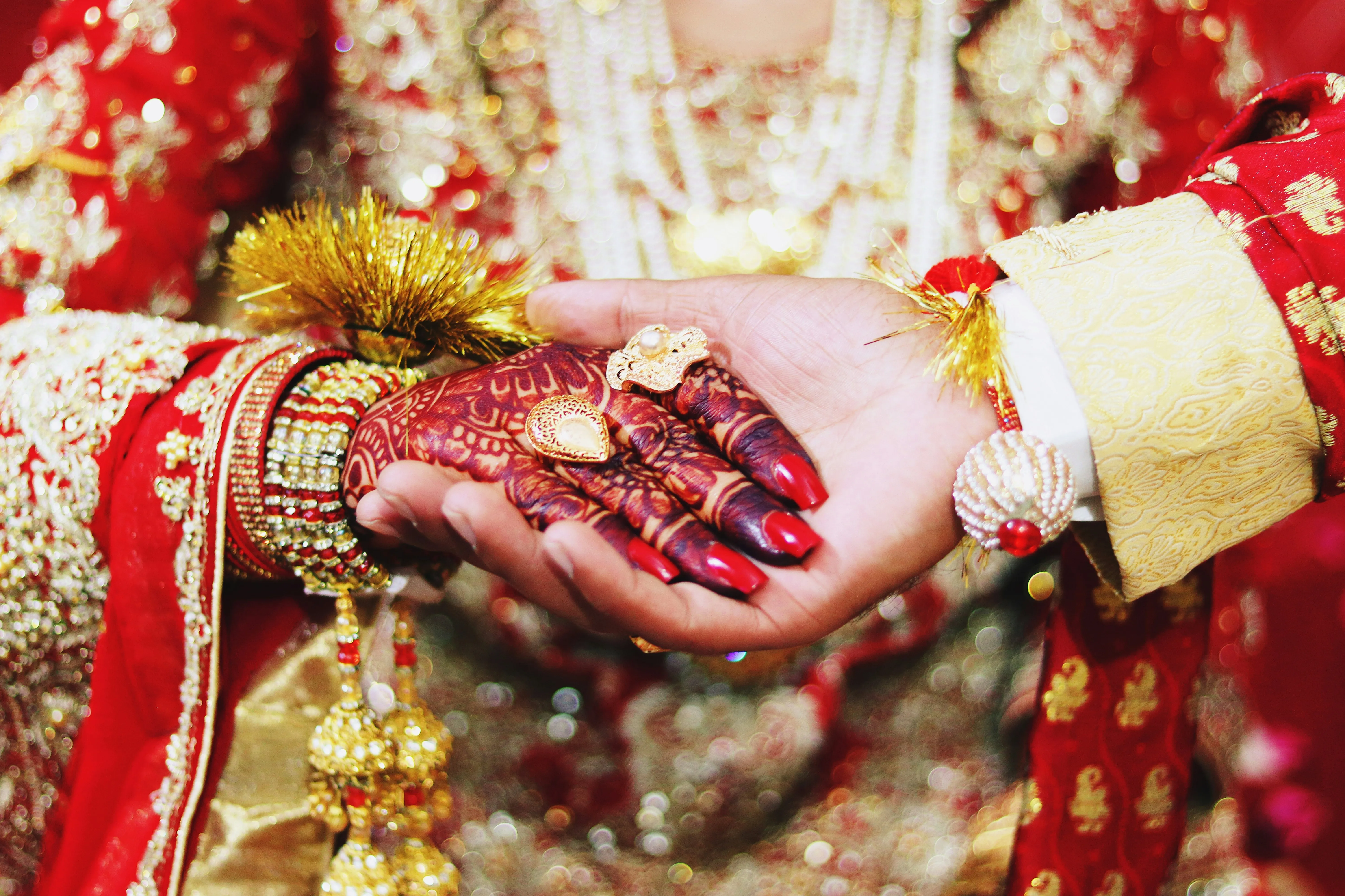 Hands Decorated with Wedding Jewelry and Henna Wallpaper