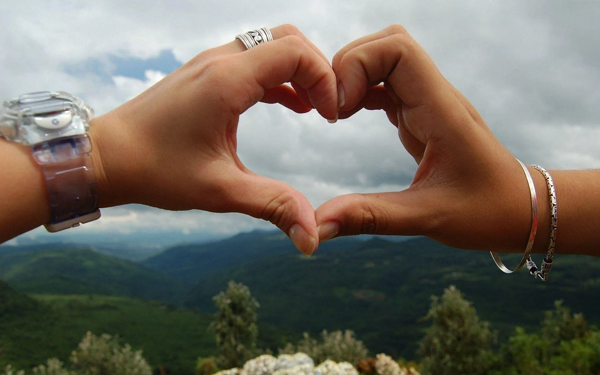 Hands Forming Heart Shape with Nature View Wallpaper