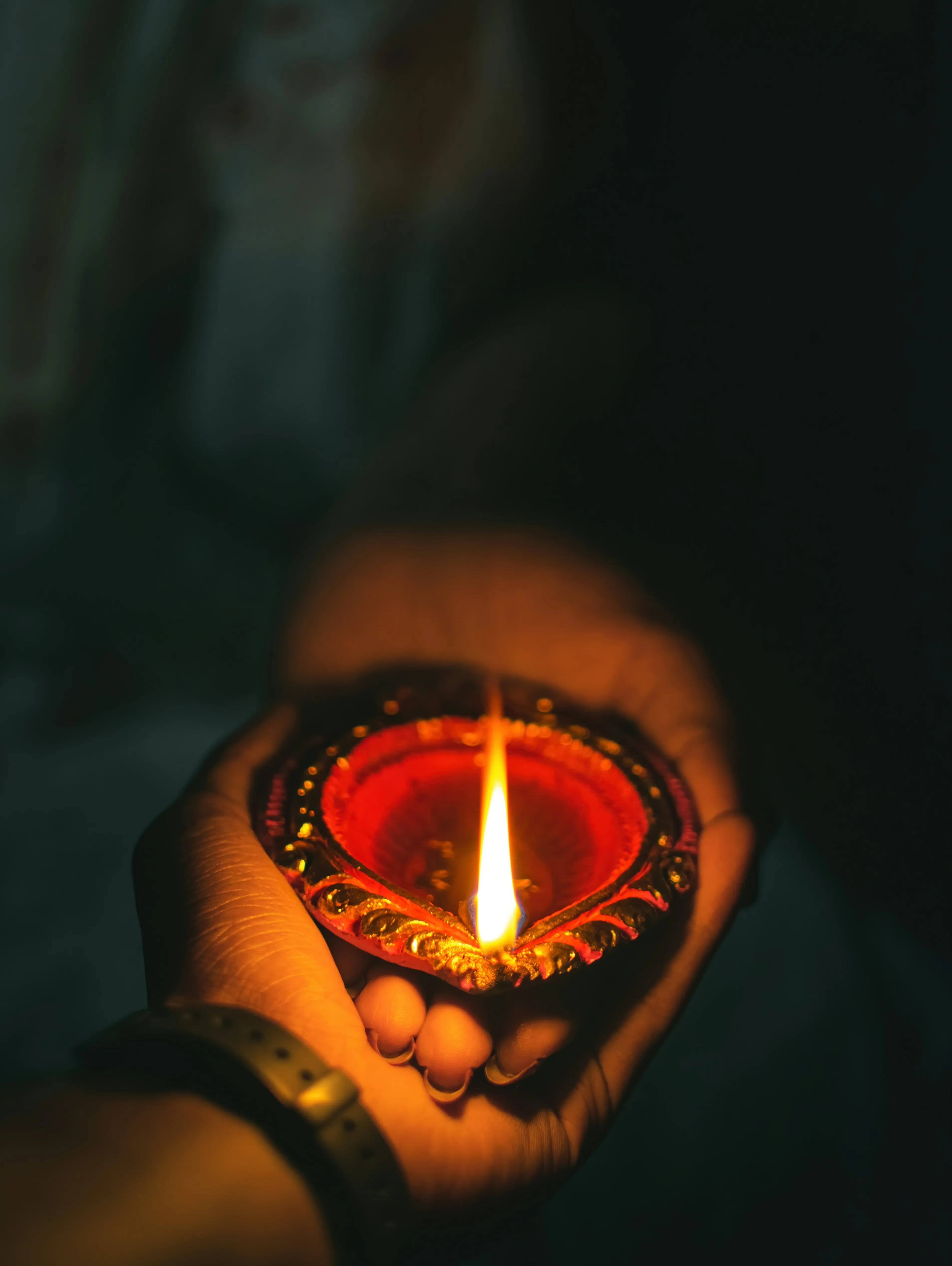 Hands Holding Candle Reflecting Warm Affection Wallpaper