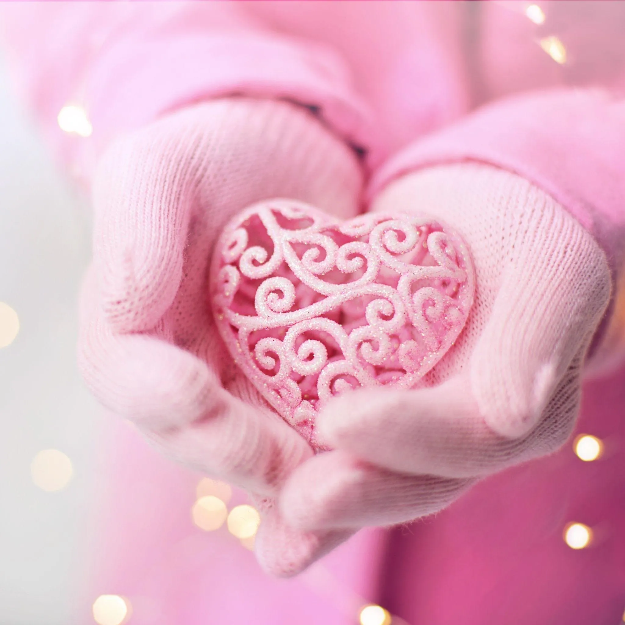 Hands Holding Heart Symbol of Kindness and Care Wallpaper