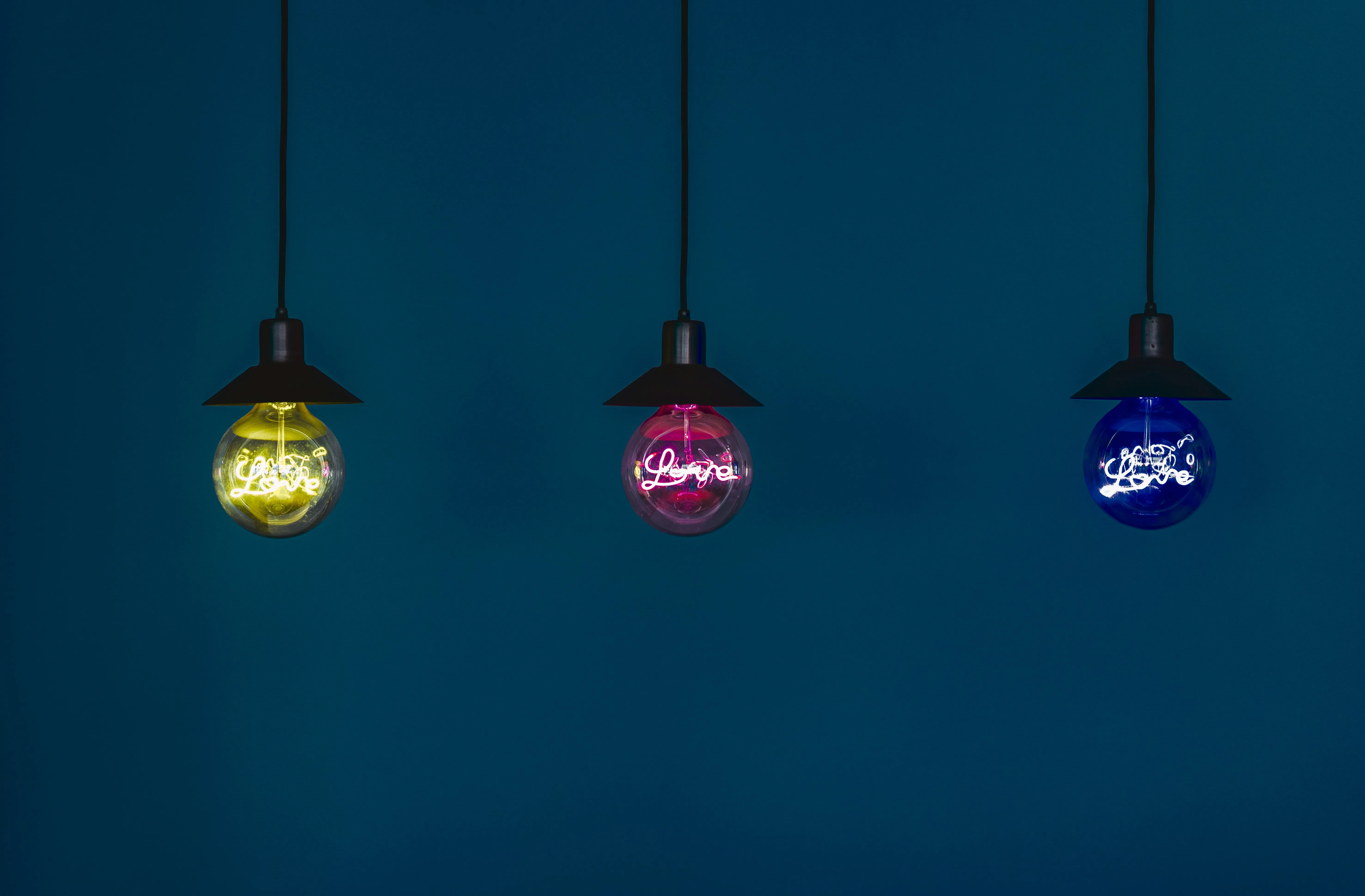 Hanging Lanterns Glowing Softly in Dark Background Wallpaper