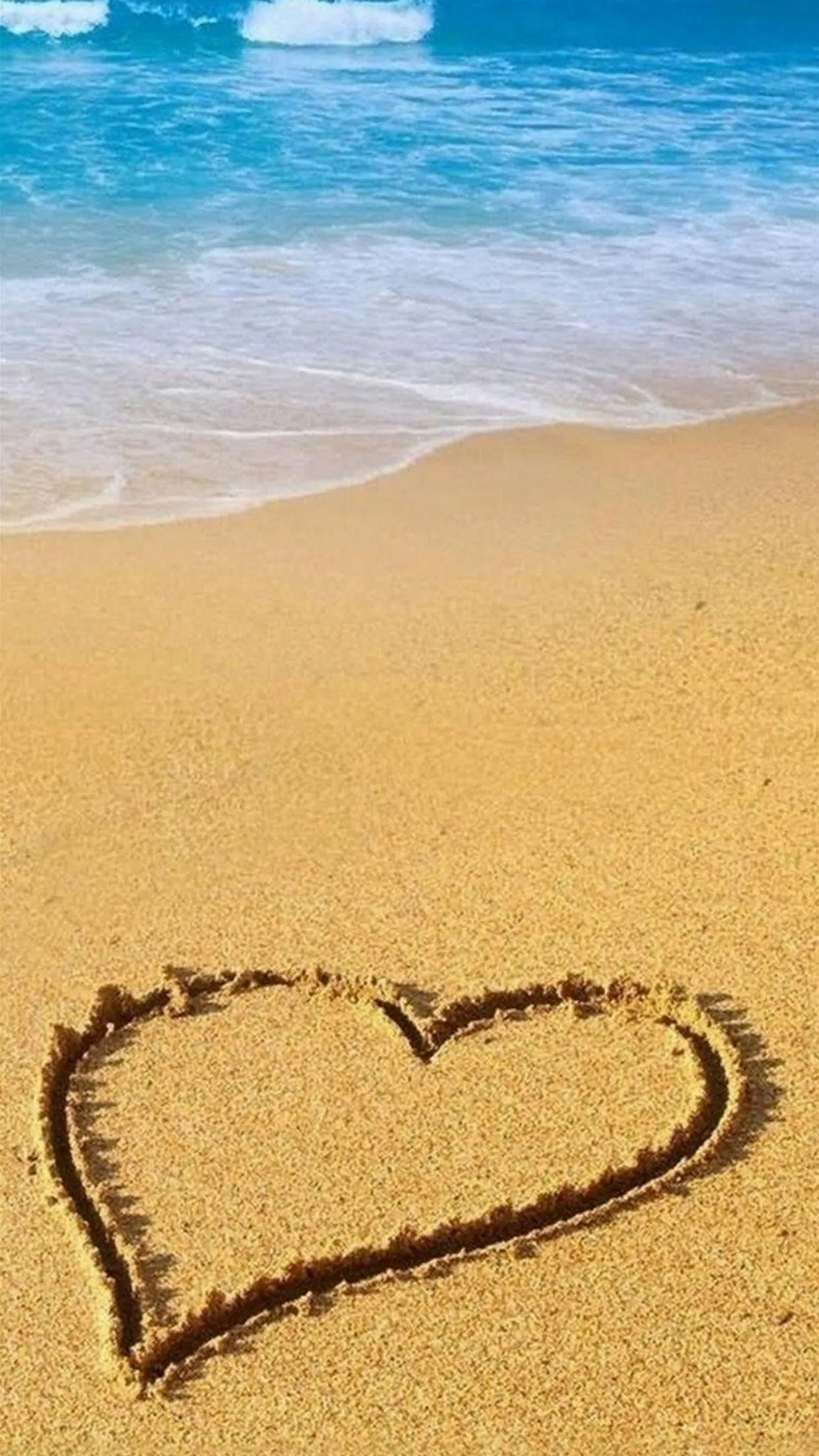 Heart Drawn on Beach Sand Symbolizing Memories Wallpaper