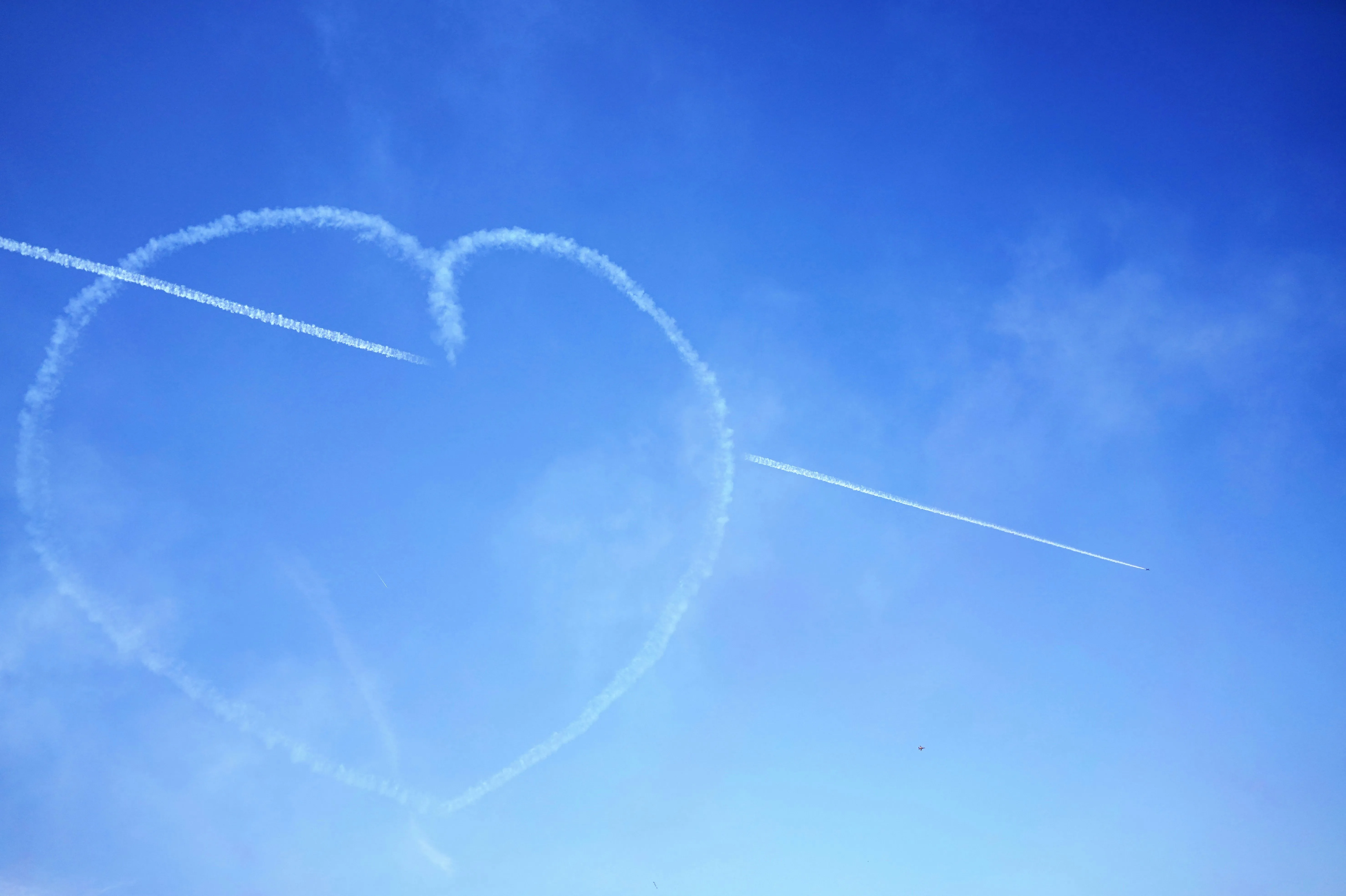 Heart Shape Drawn in Blue Sky with White Clouds Wallpaper
