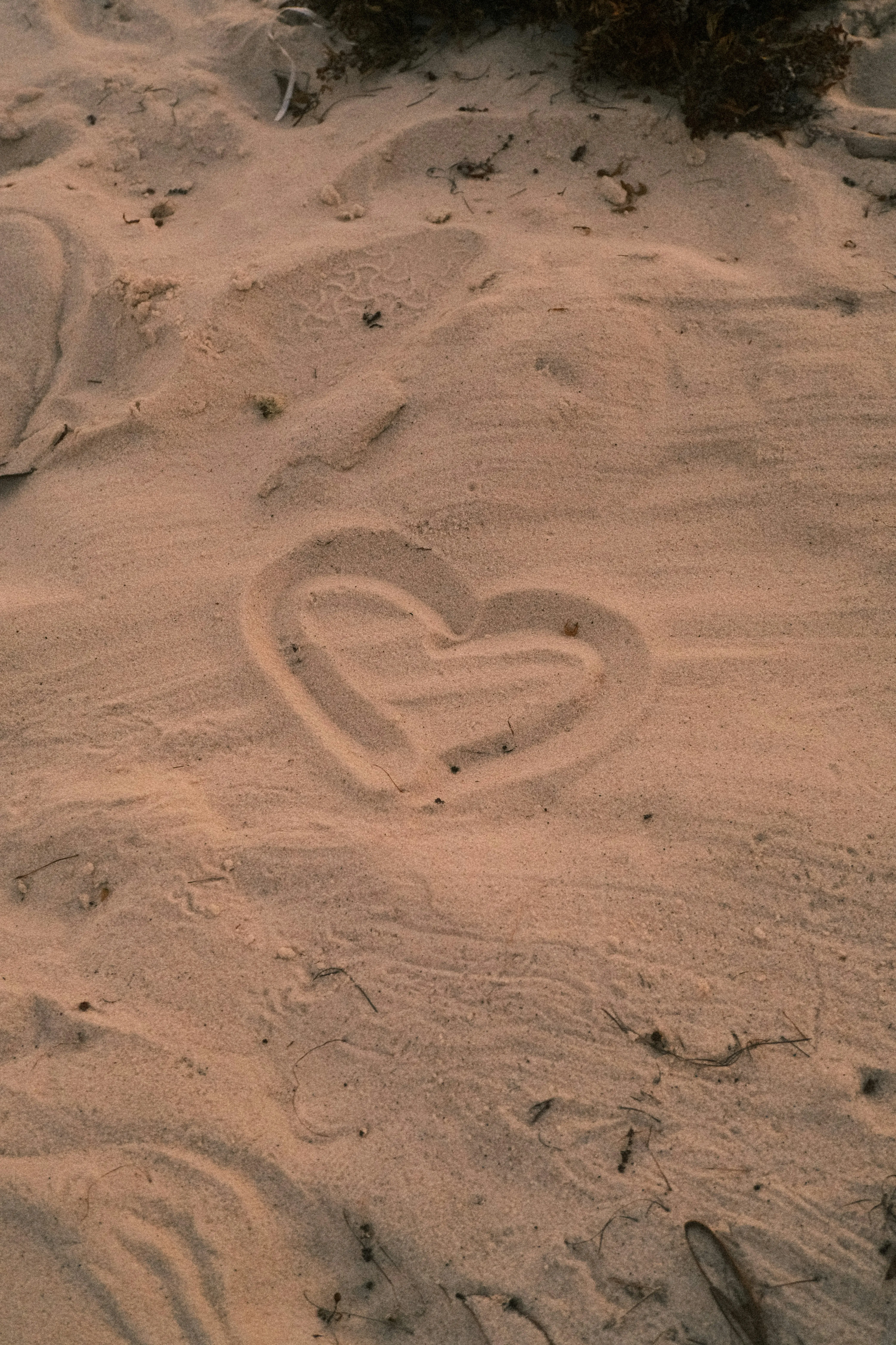 Heart Shape Drawn in Sand Showing Pure Emotion Wallpaper