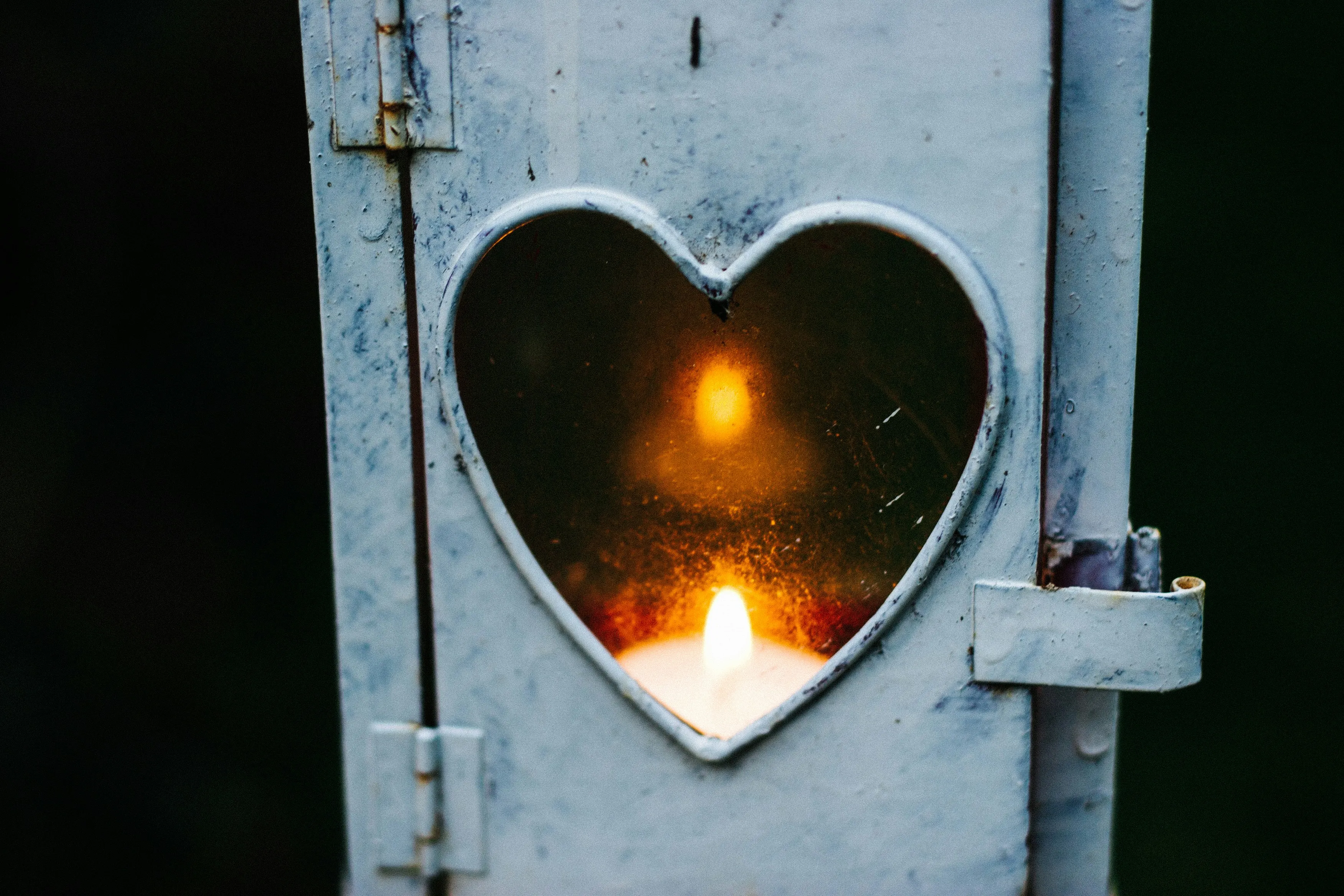 Heart Shaped Light Glowing in Metal Lantern Wallpaper