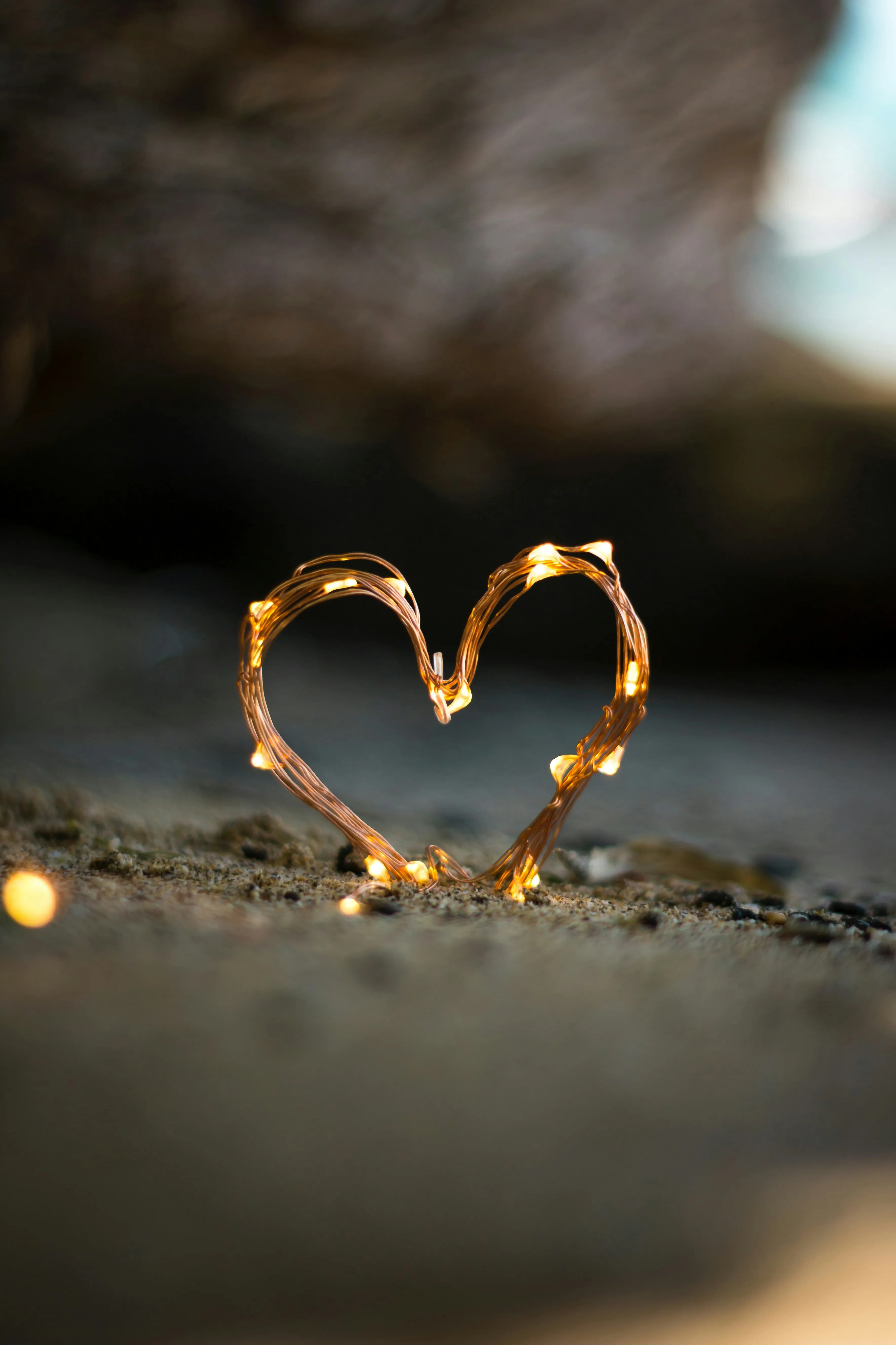 Heart Shaped Ring Reflecting Warm Golden Glow Wallpaper