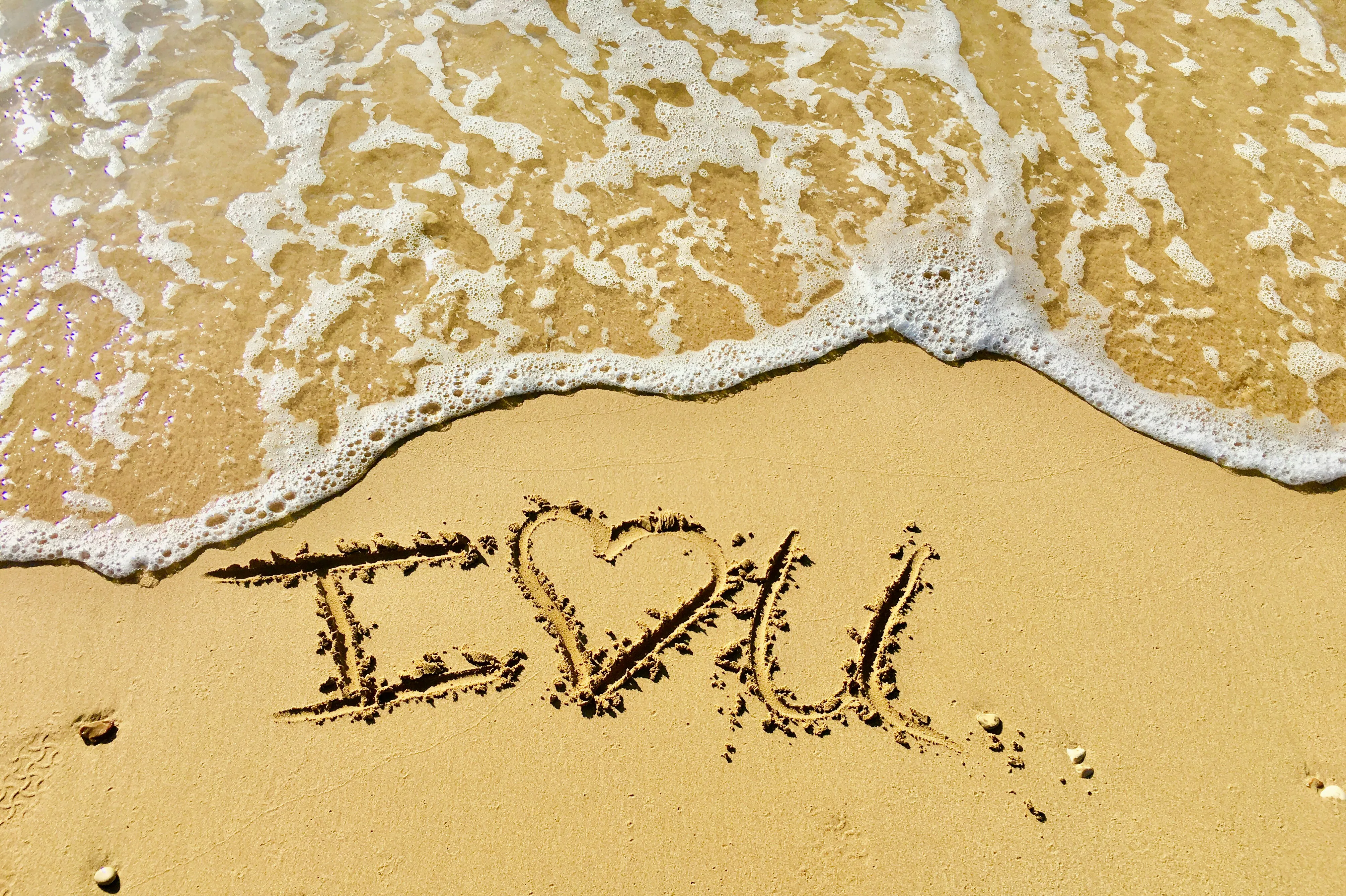 I Love You Written in Sand Symbolizing Pure Devotion