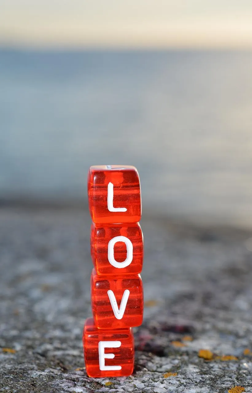 LOVE Blocks on Beach Representing Strong Connection