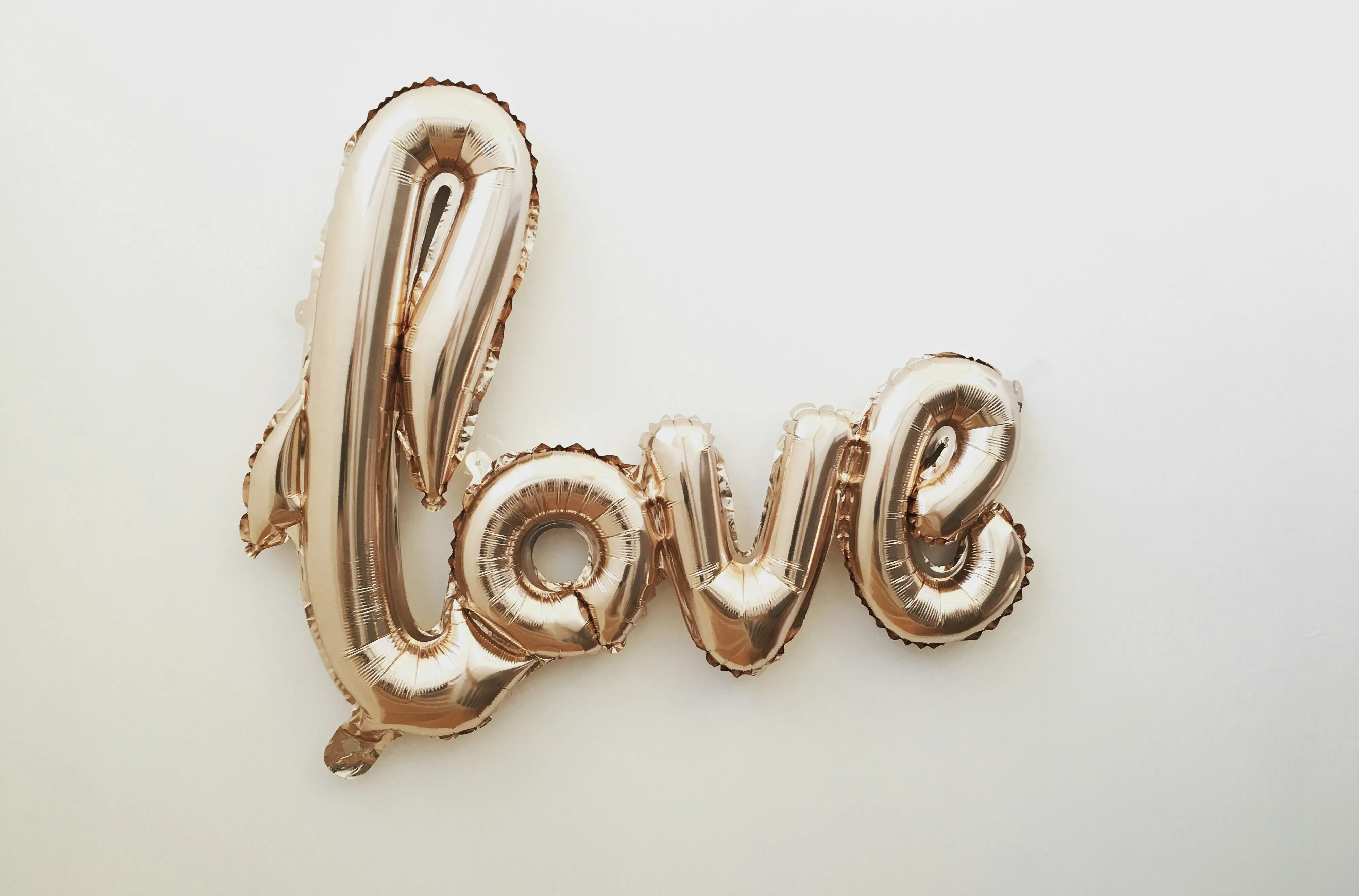 Love Word Decor on Wall Reflecting Warm Affection Wallpaper