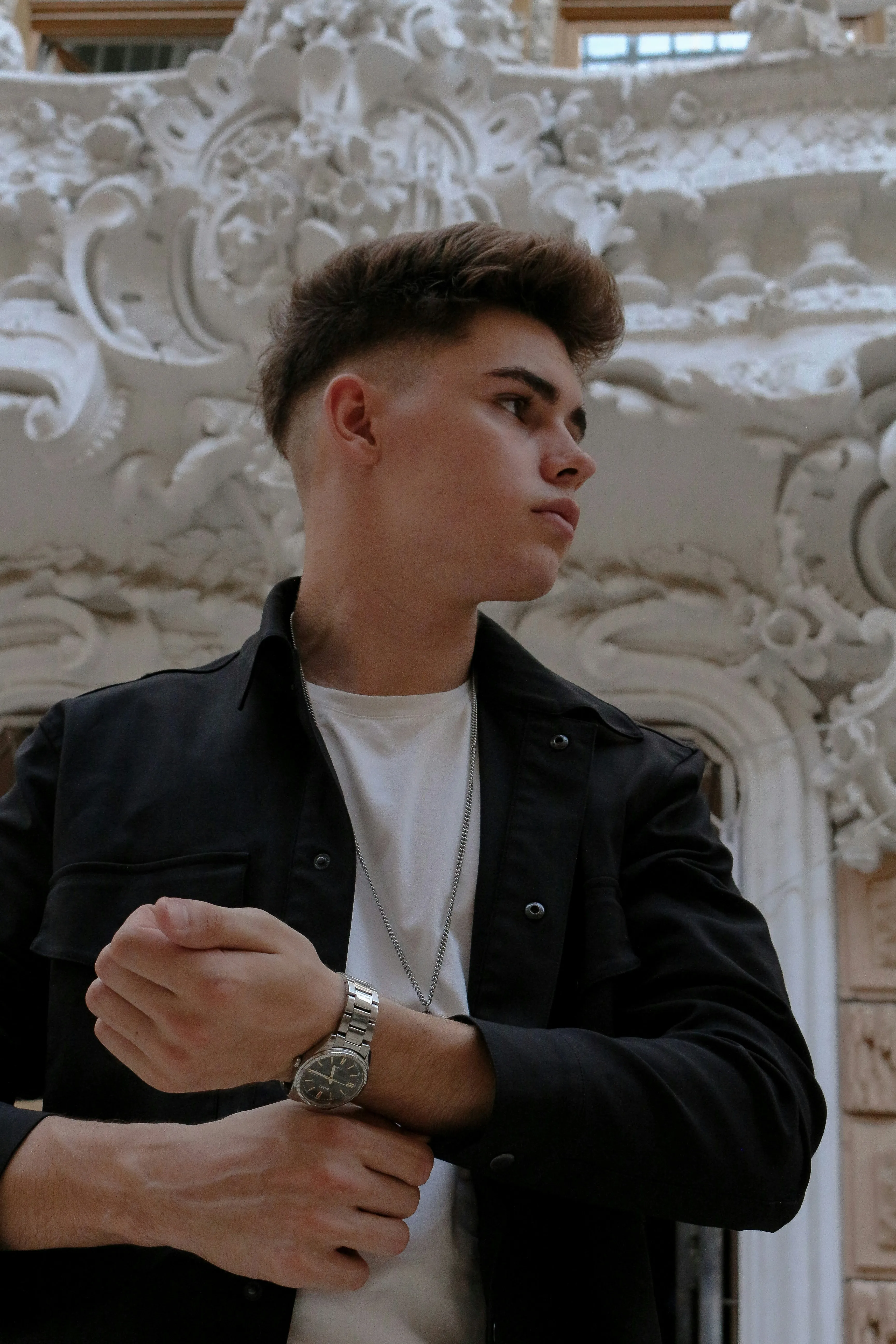 Man Standing Confidently in Stylish Modern Attire Wallpaper