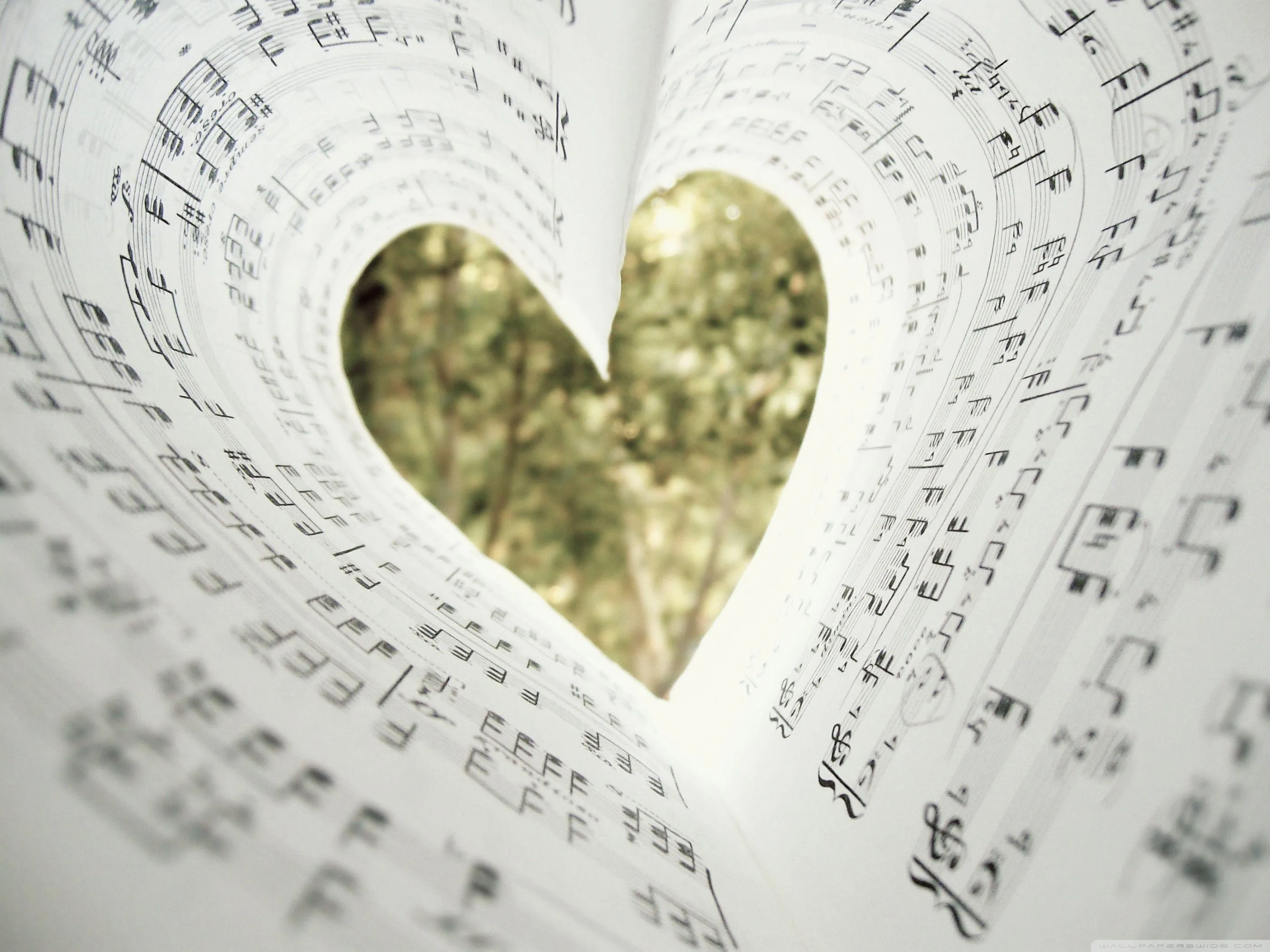 Music Sheet Forming Heart Shape with Natural Background