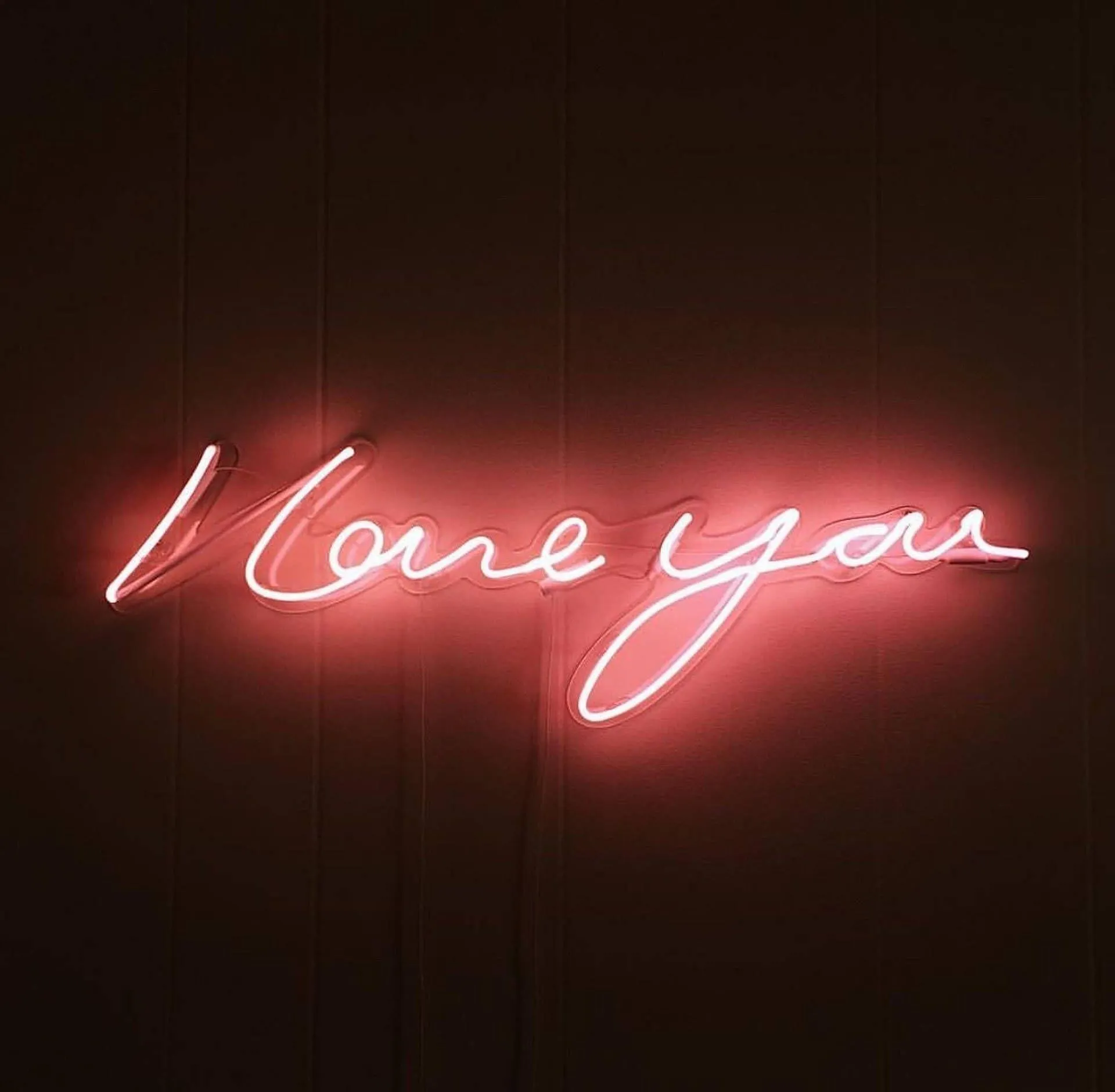 Neon Sign Glowing with the Words I Love You Wallpaper