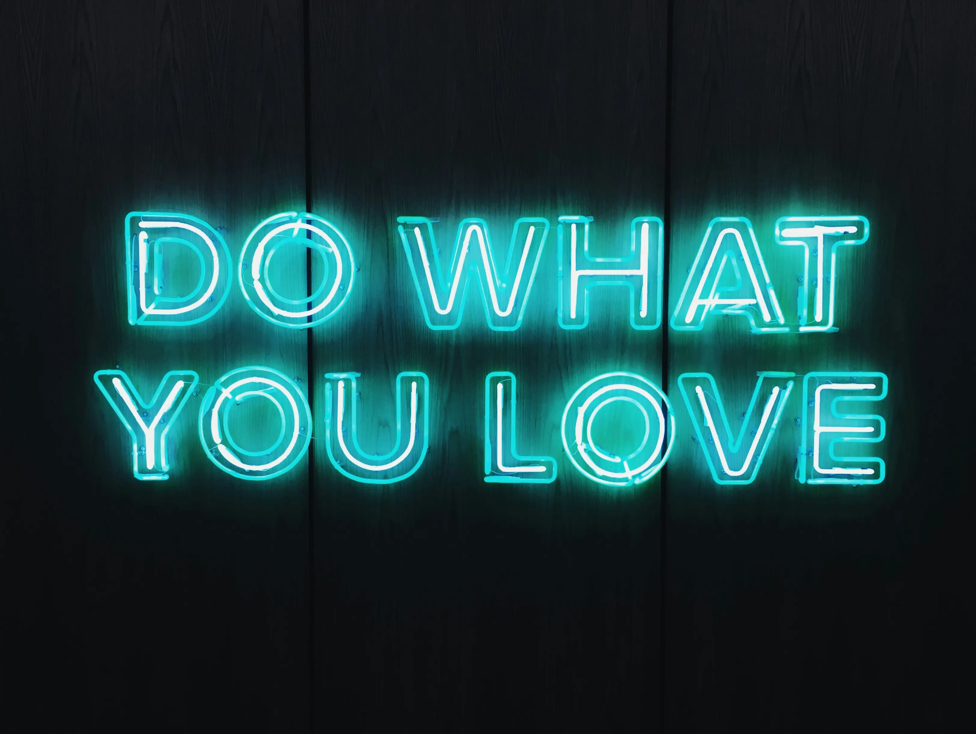 Neon Text Inspiring You to Do What You Love Wallpaper