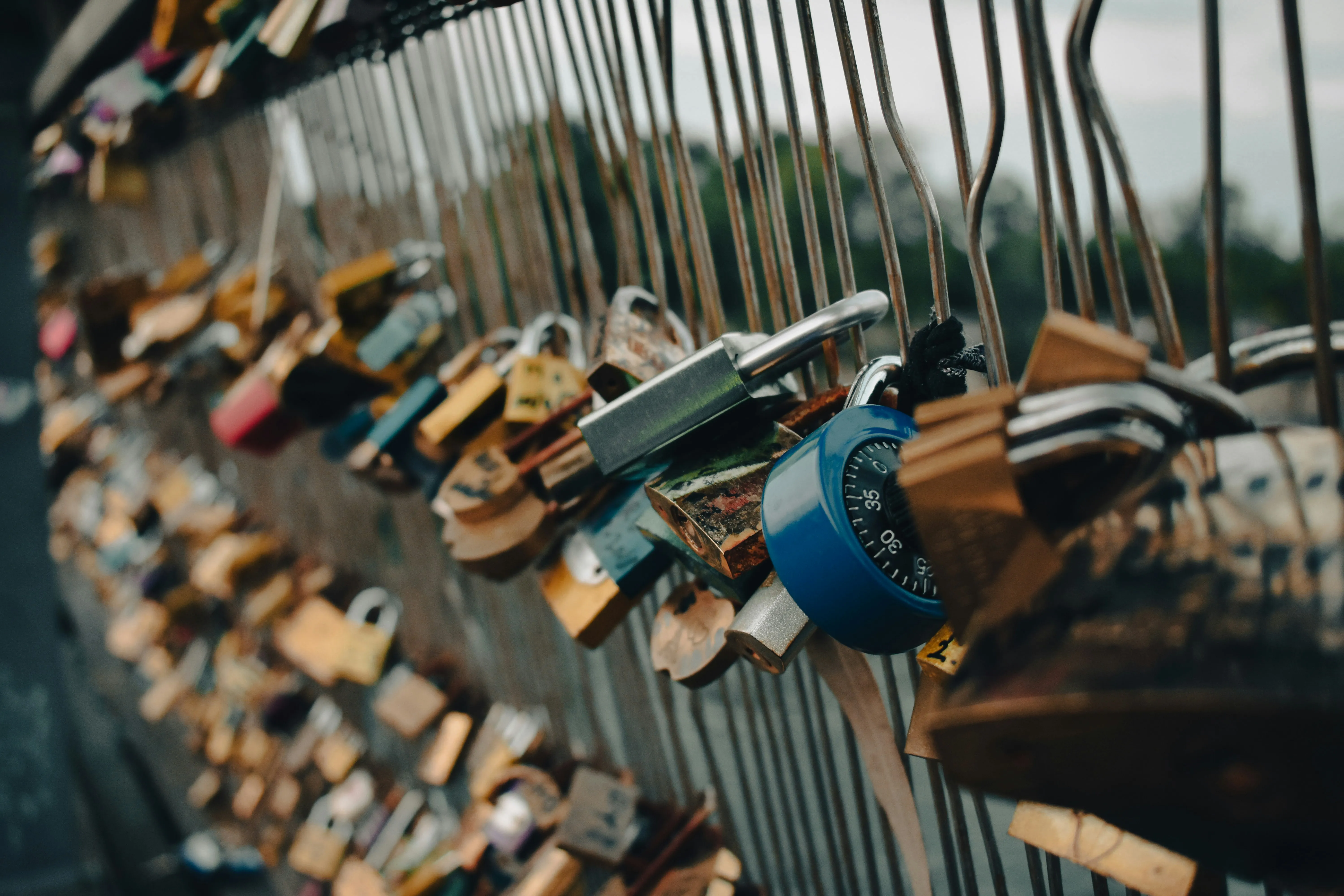 Padlocks Hanging on Bridge Representing True Love Wallpaper