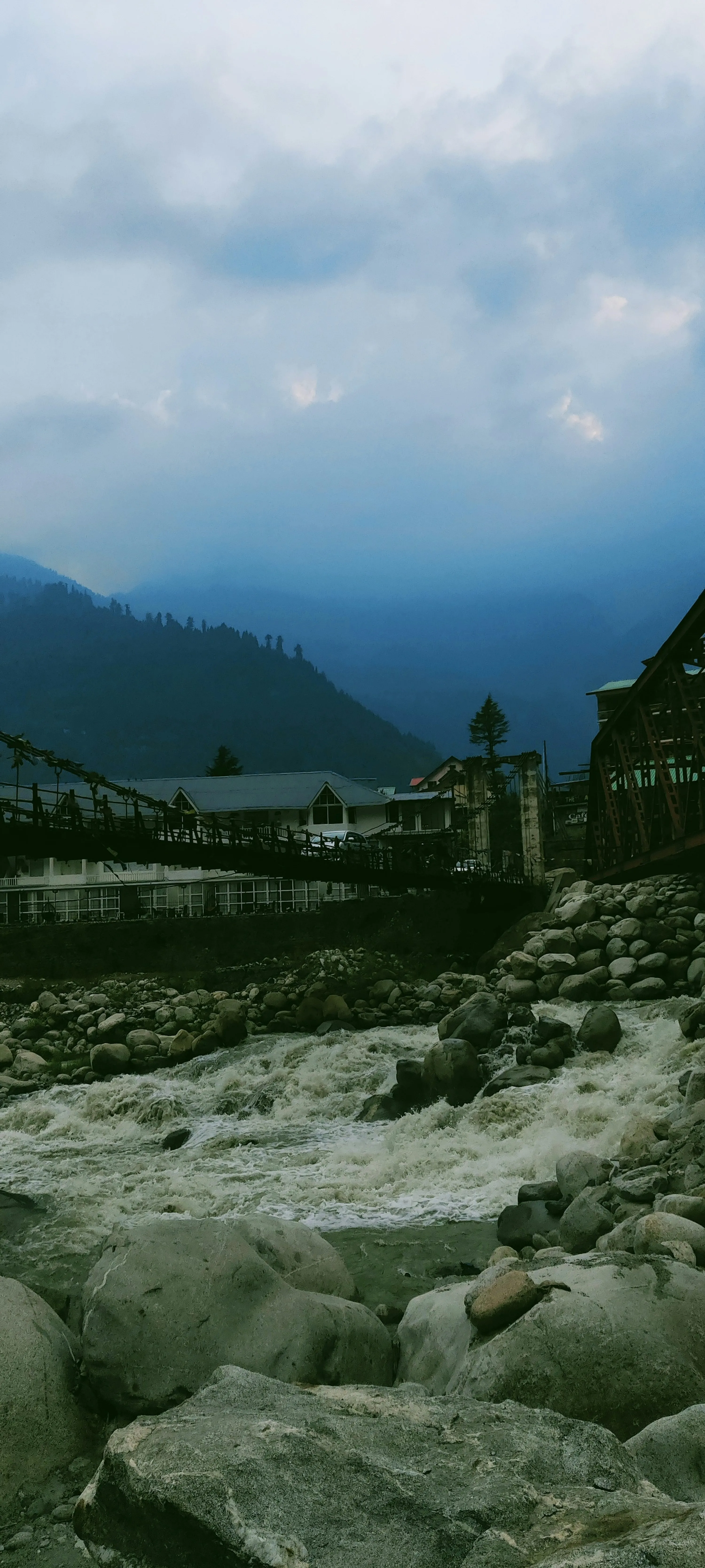 Peaceful Mountain Landscape with Misty Horizon Wallpaper